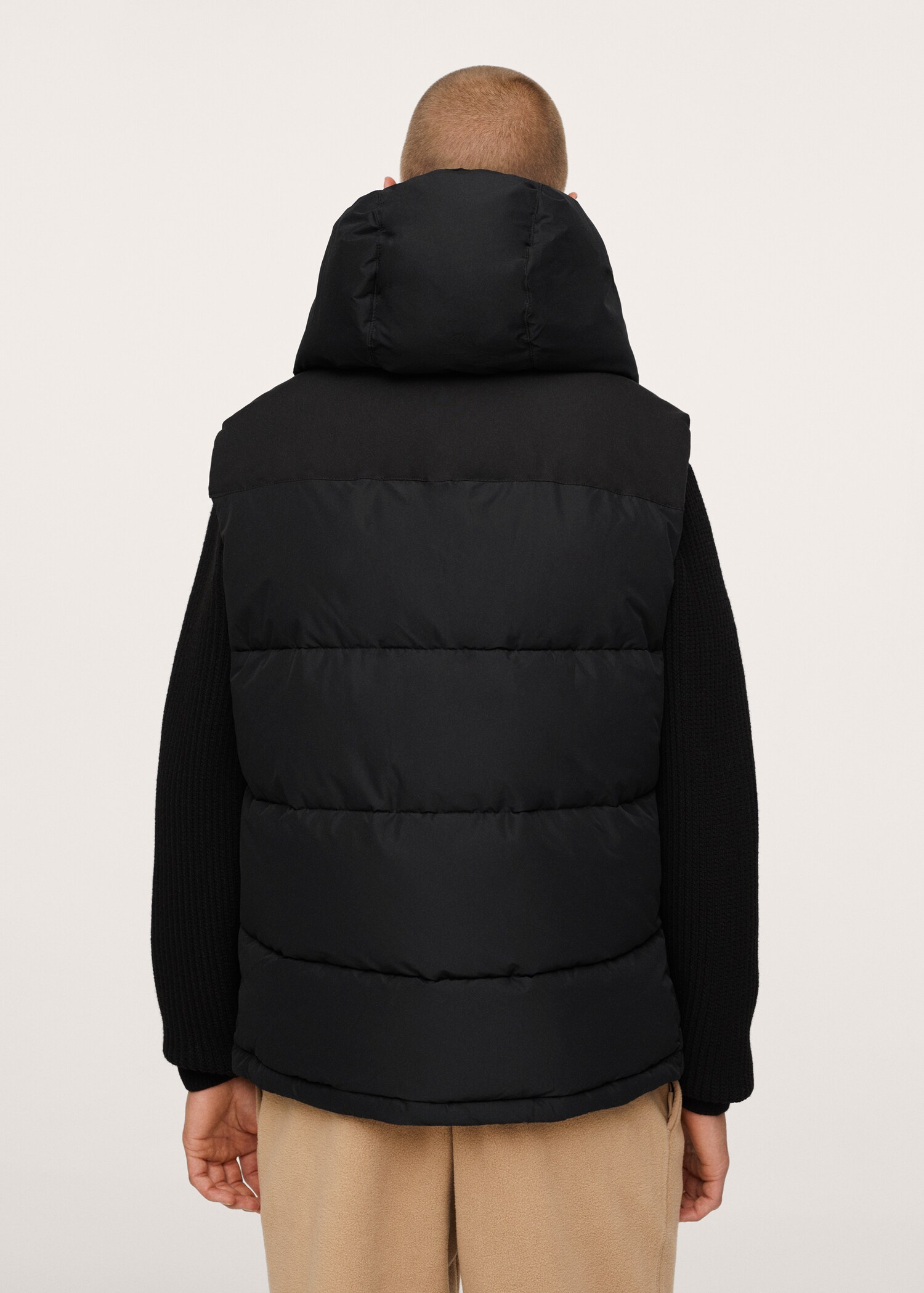 Quilted gilet with hood - Reverse of the article