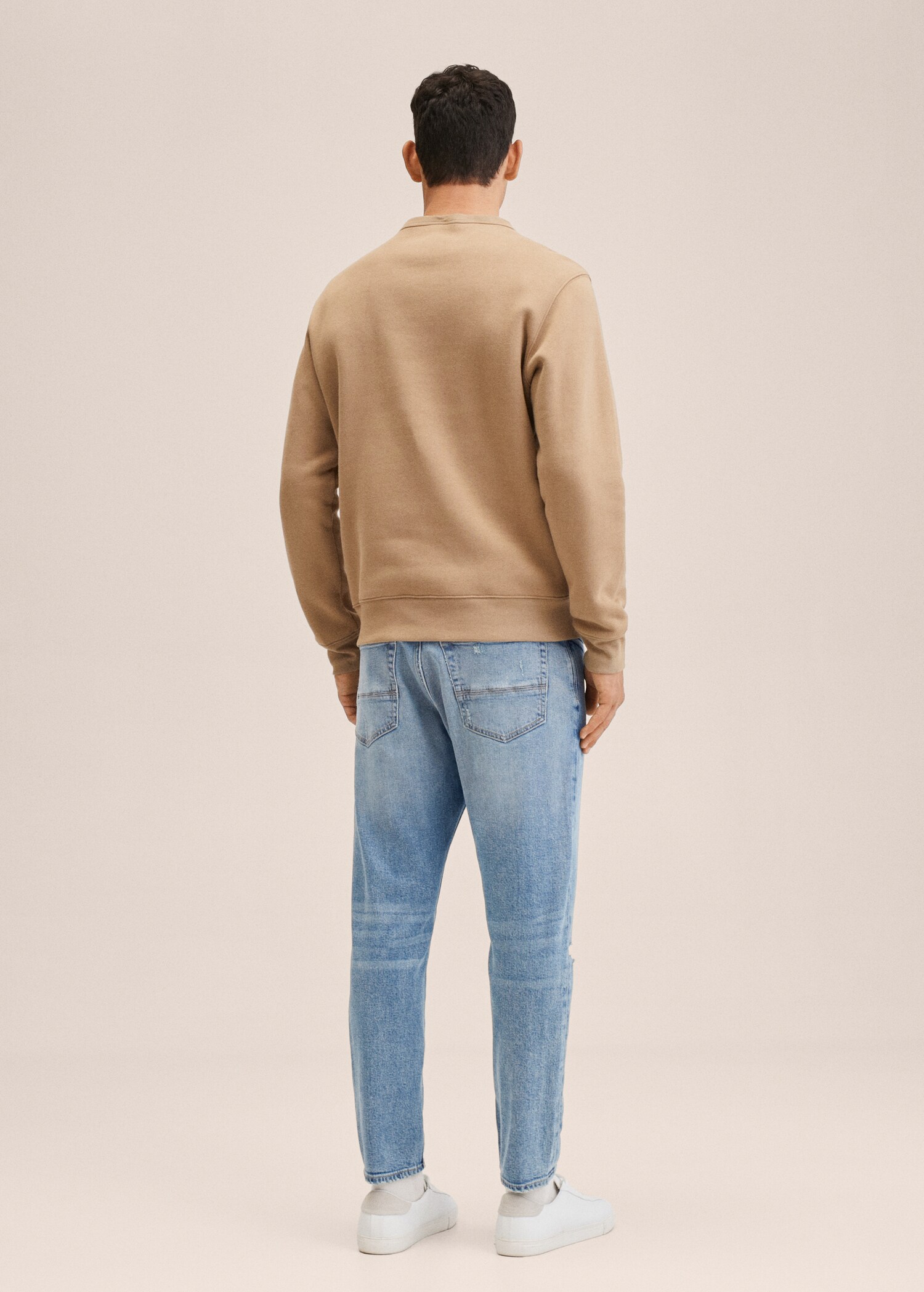 Ripped tapered-fit jeans - Reverse of the article