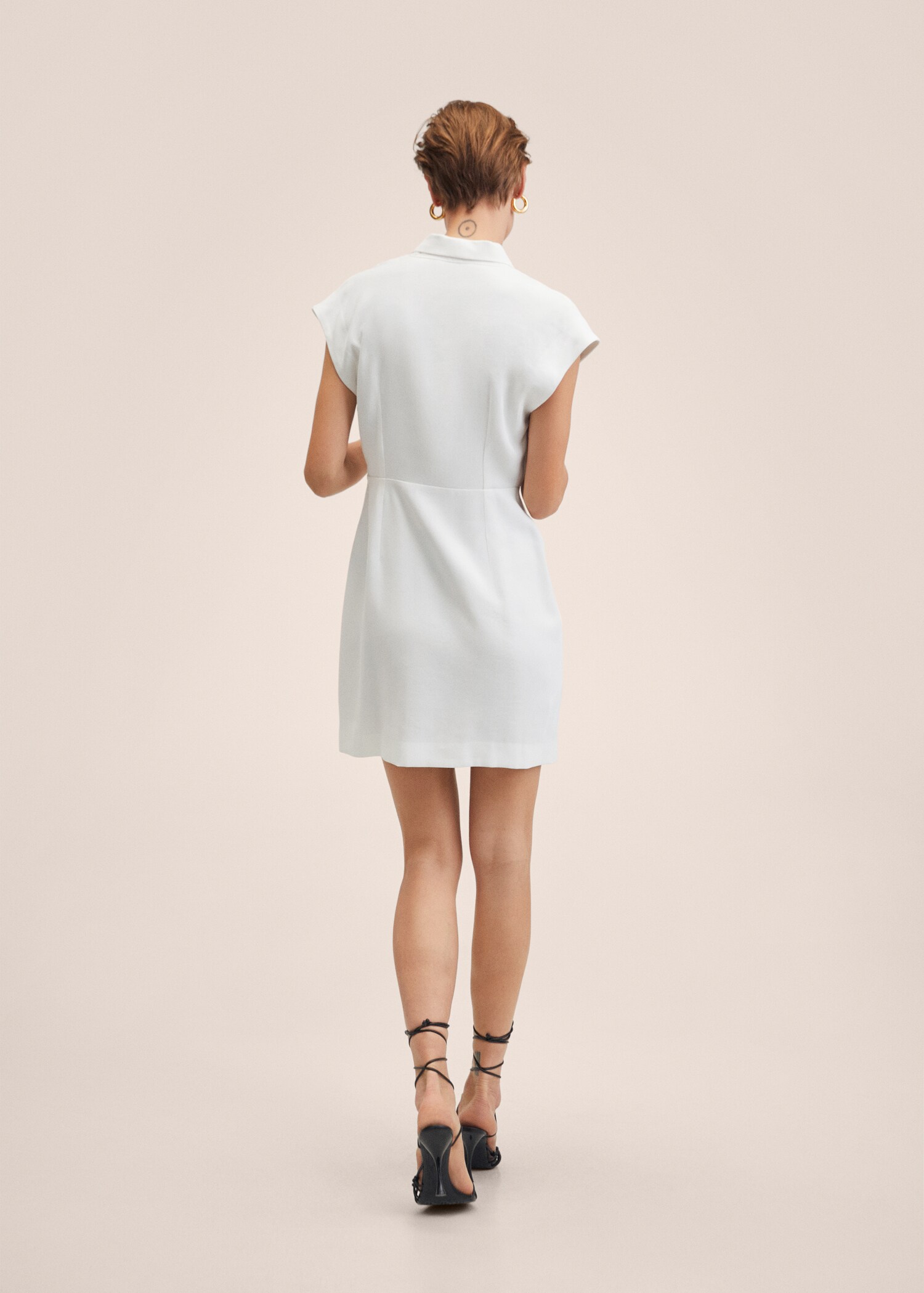 Vestit nit escot creuat - Revers de l'article