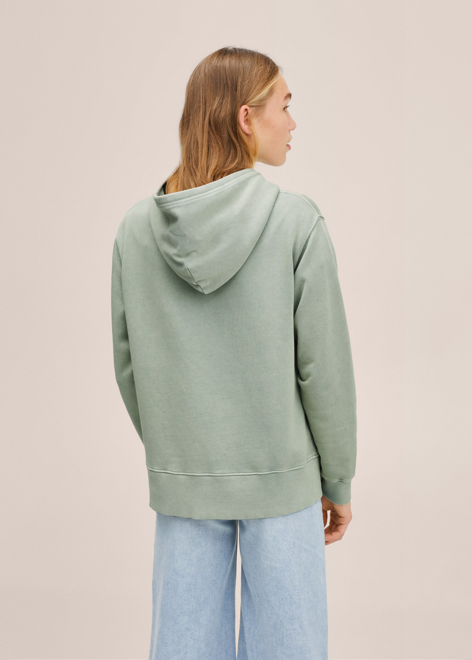 Dessuadora unisex col·lecció T - Revers de l'article