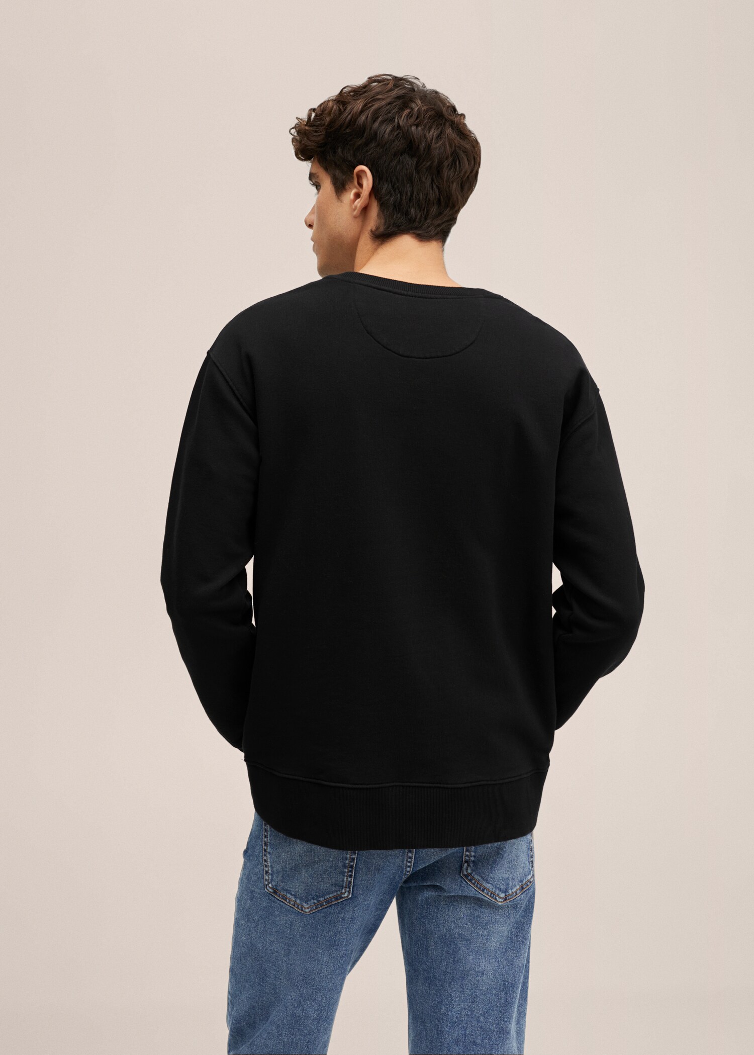 Dessuadora unisex col·lecció T - Revers de l'article