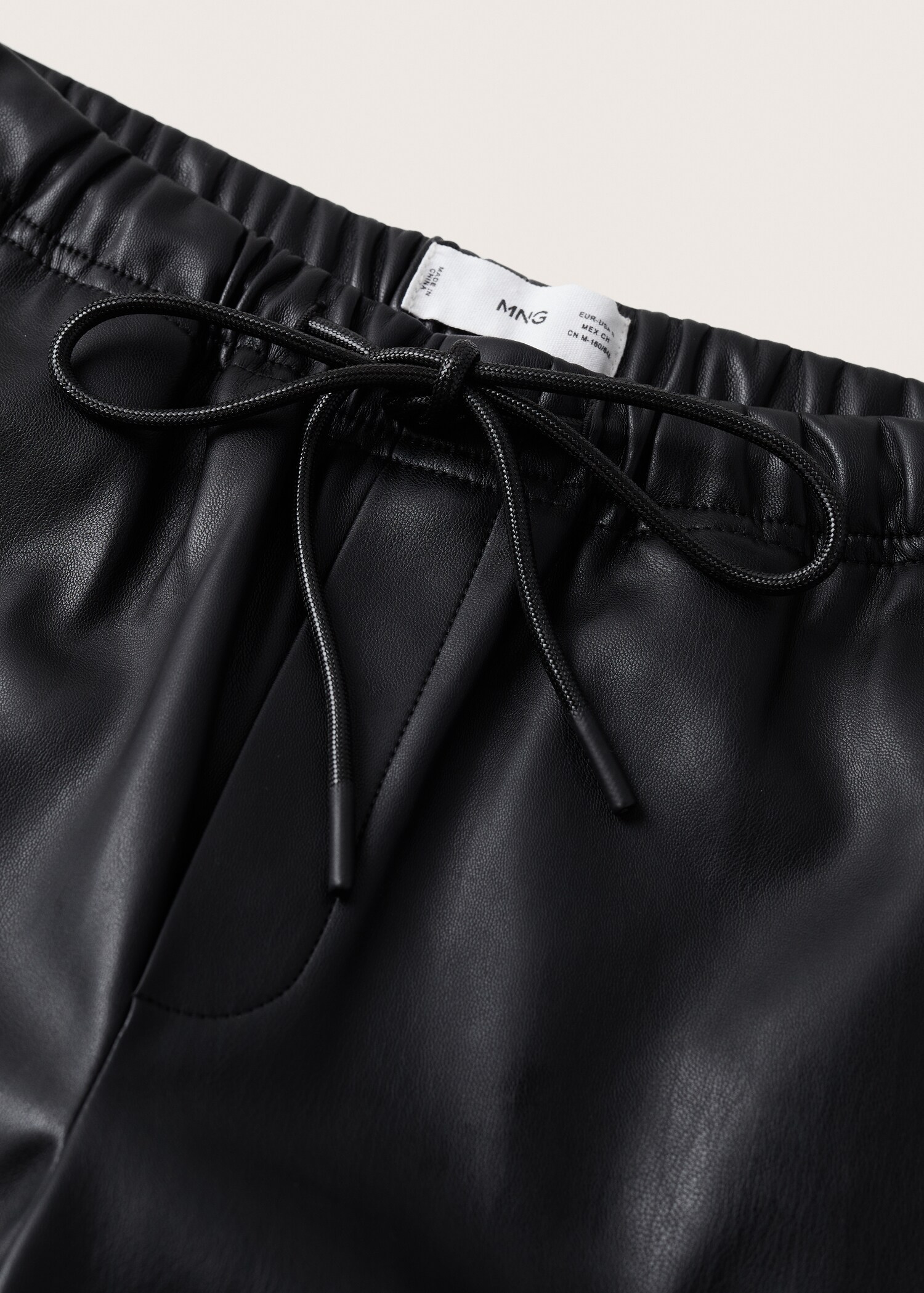 Leather-effect elastic waist trousers - Details of the article 8
