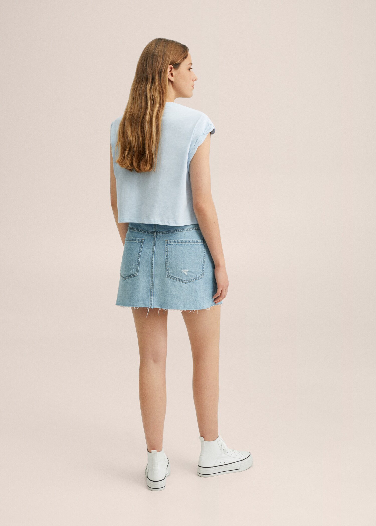 Denim miniskirt with frayed hem - Reverse of the article