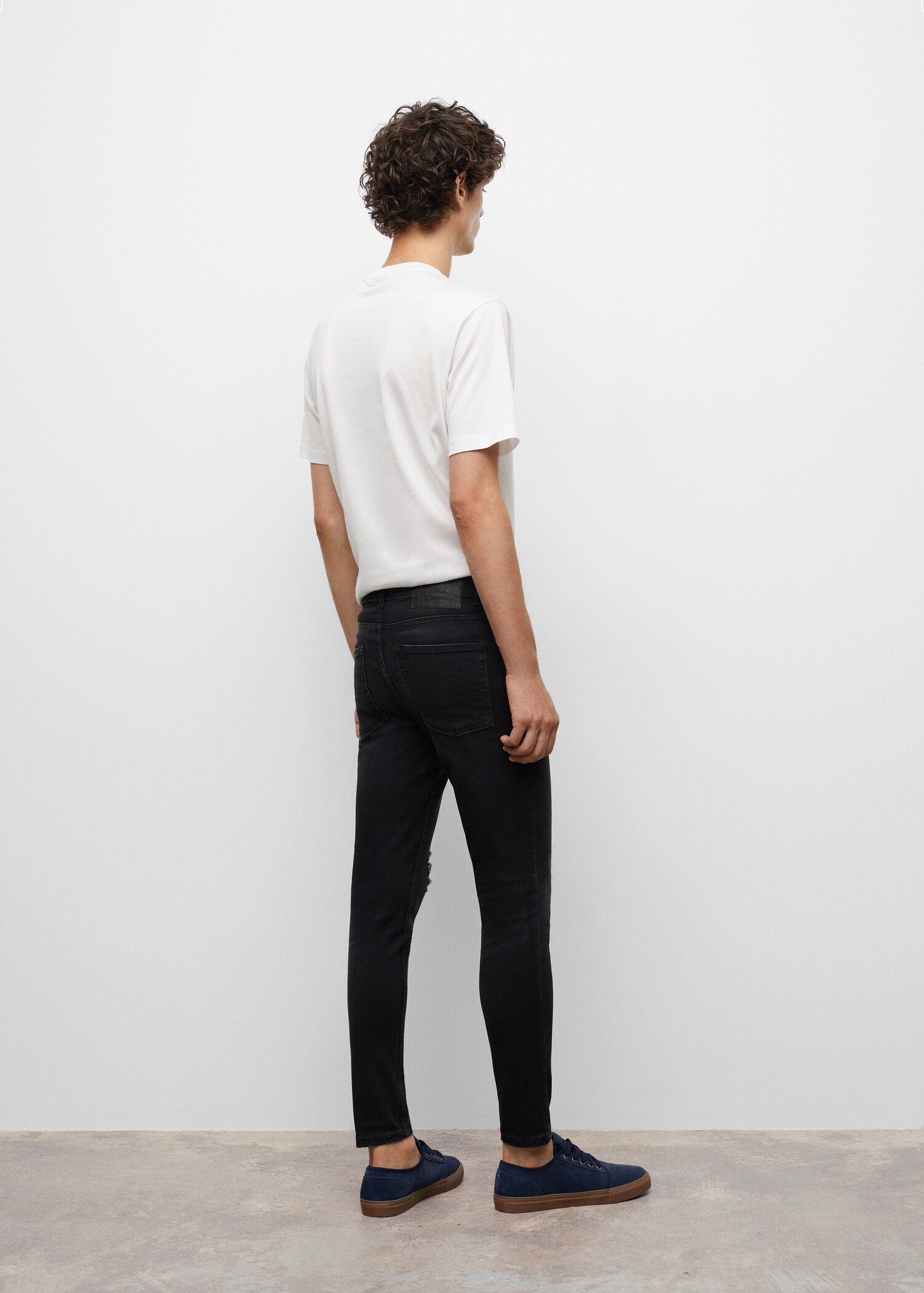 Ripped details skinny-fit jeans - Reverse of the article
