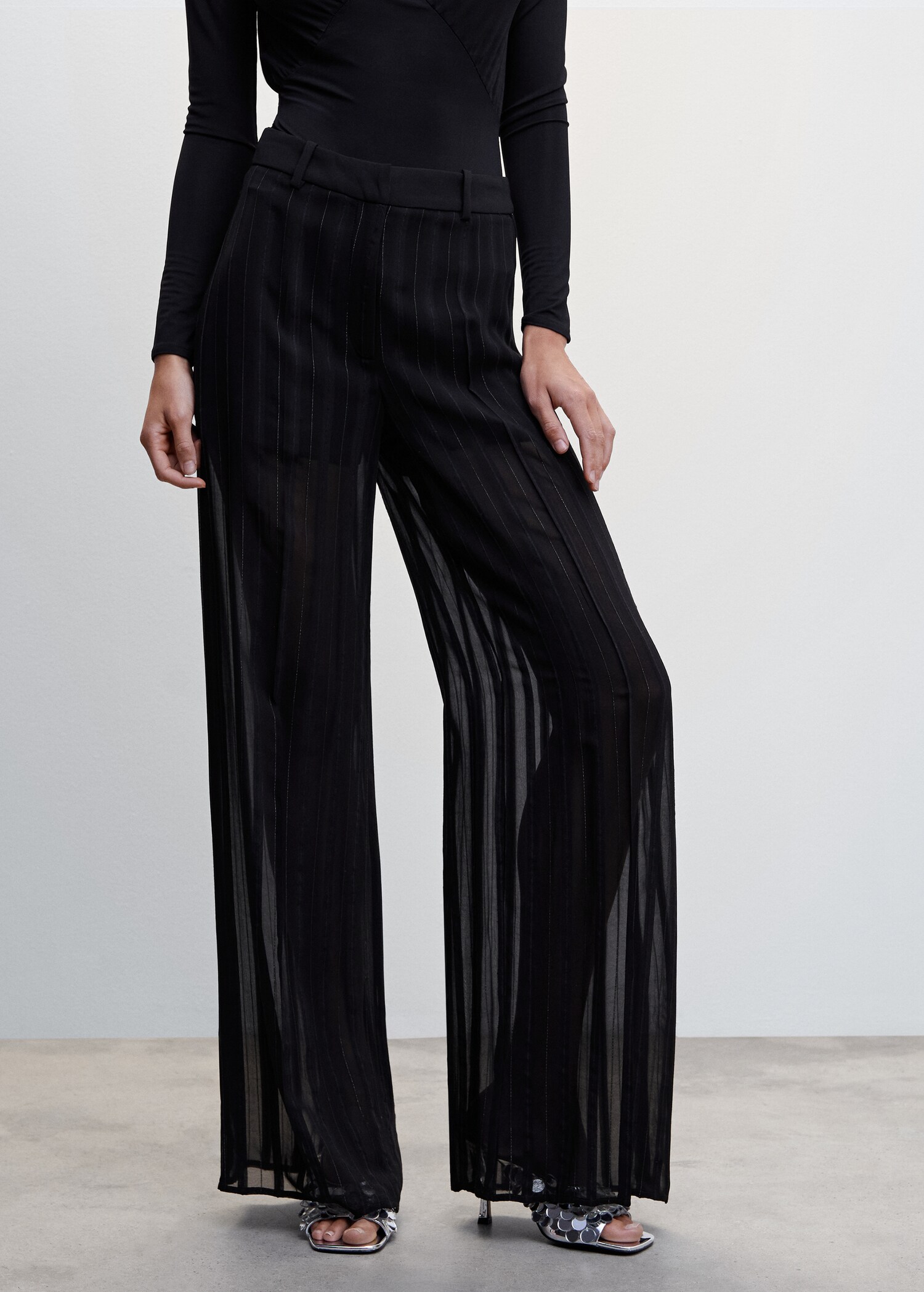 Pantaloni semitrasparenti gessati - Piano medio