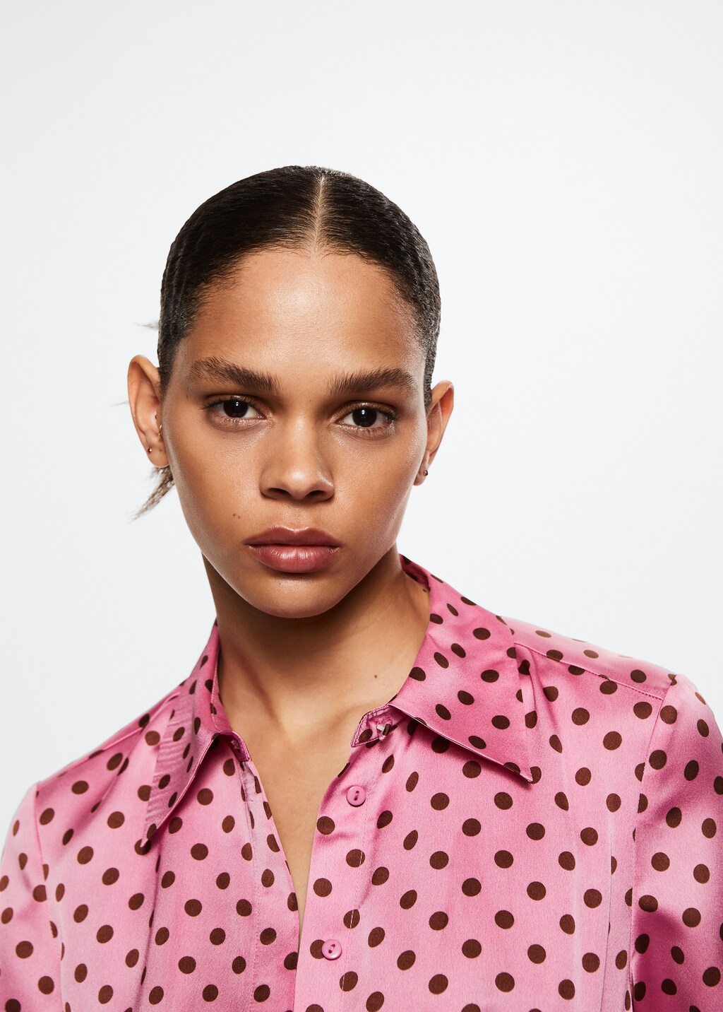 pink and black polka dot shirt