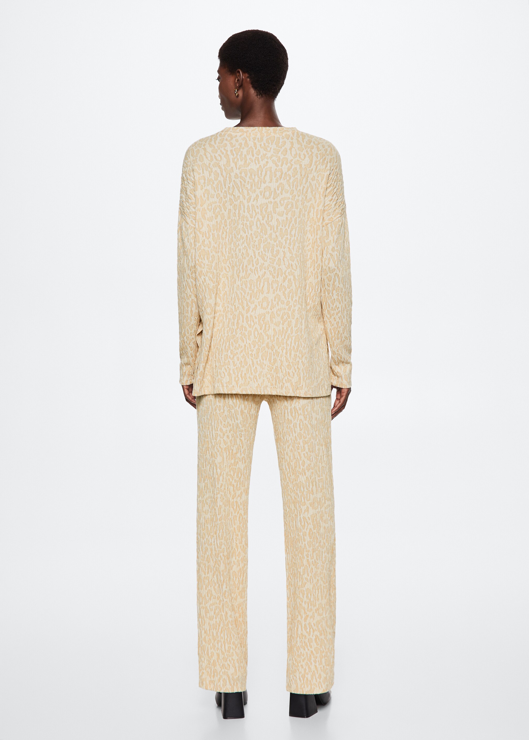 Textured knitted trousers - Reverse of the article