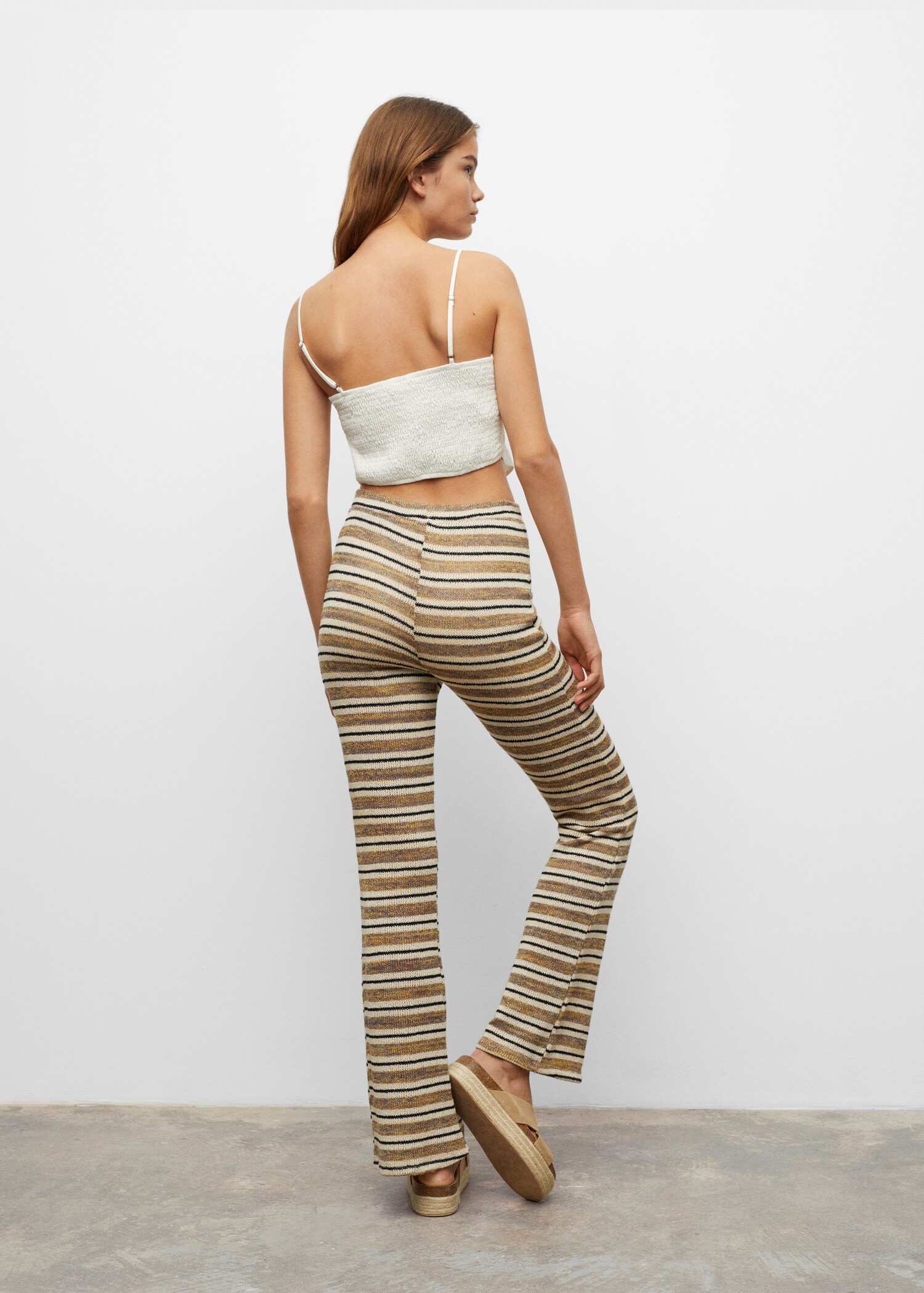 Striped-design trousers - Reverse of the article