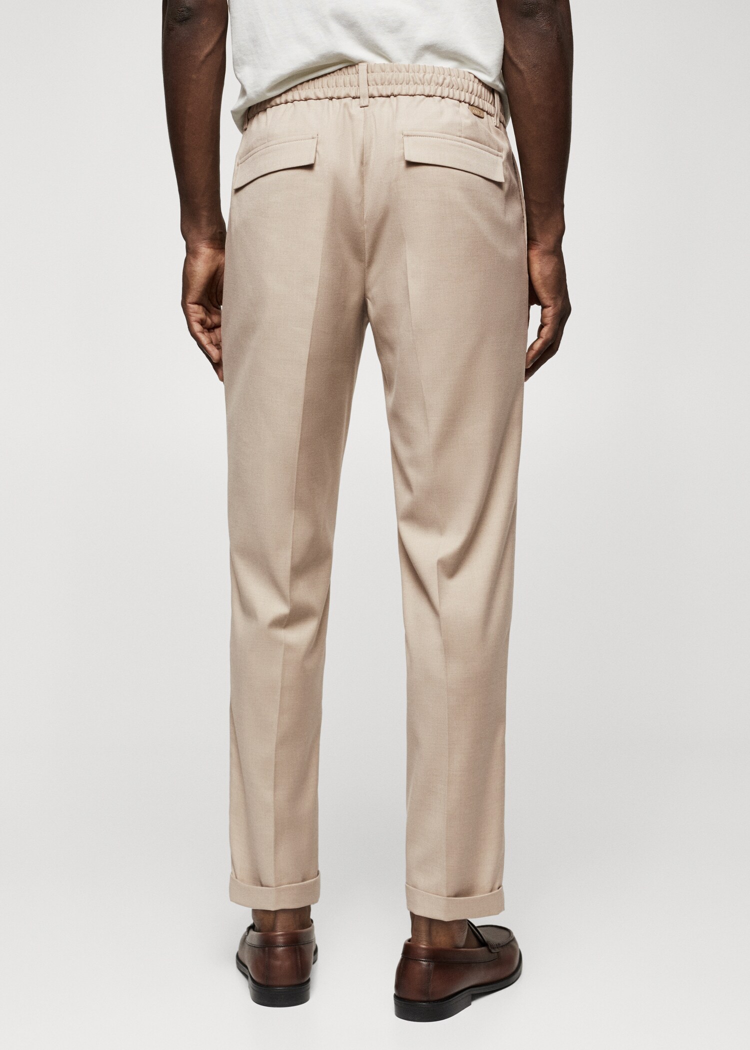 Pleated slim-fit pants - Reverse of the article