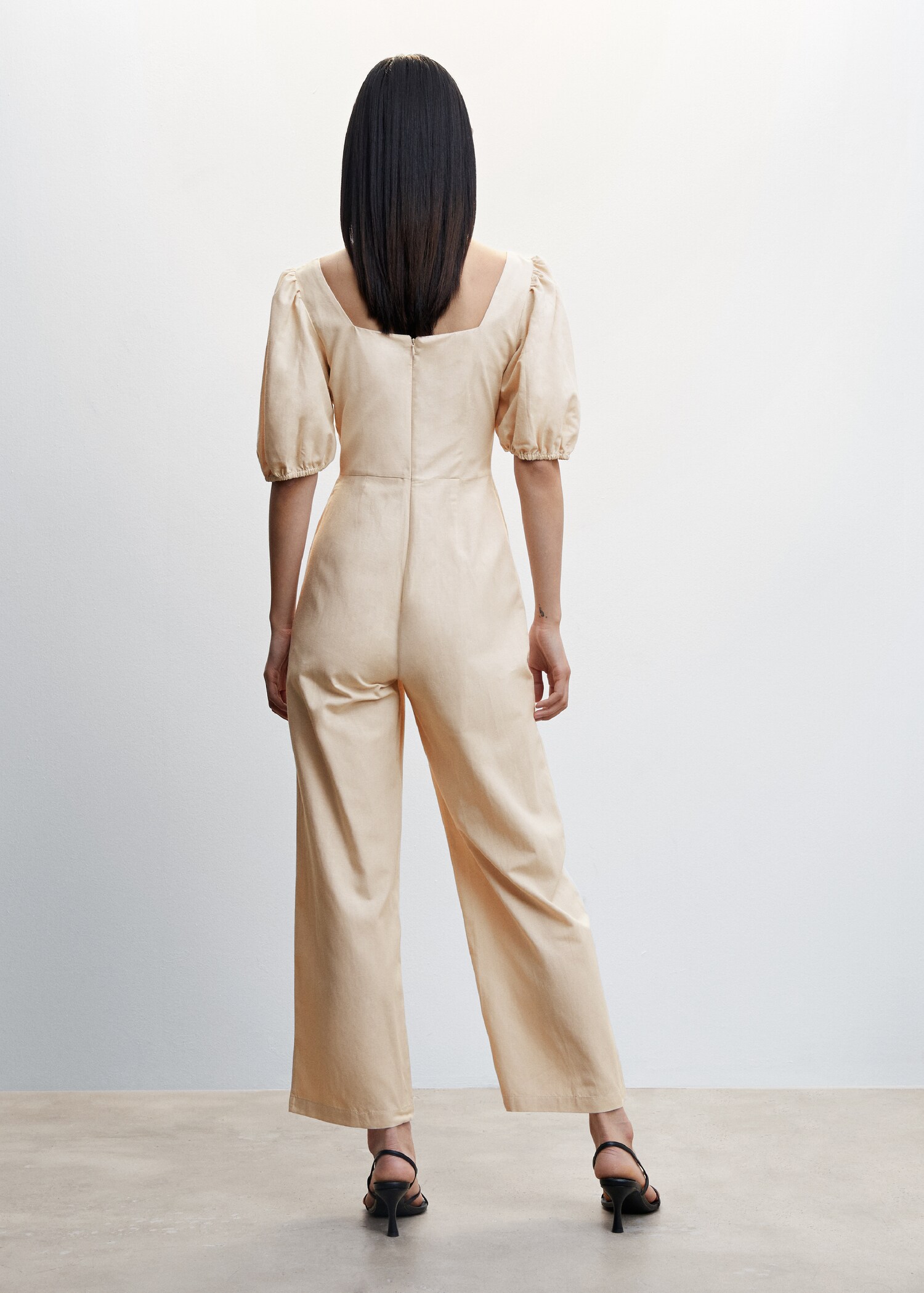 Jumpsuit with puffed sleeves - Reverse of the article