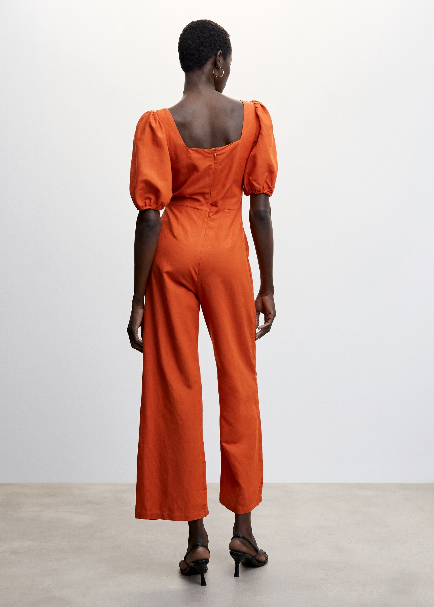 Jumpsuit with puffed sleeves - Reverse of the article