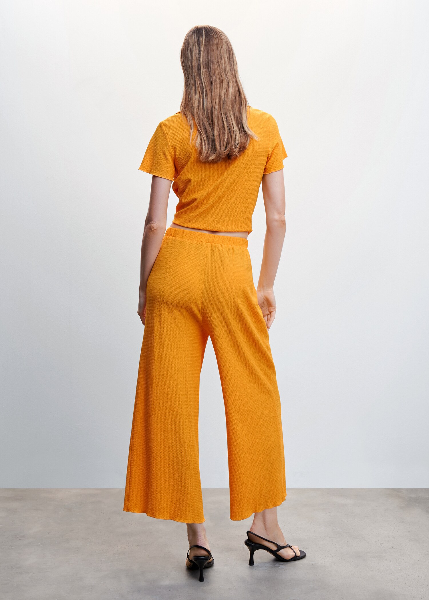 Textured flowy pants - Reverse of the article