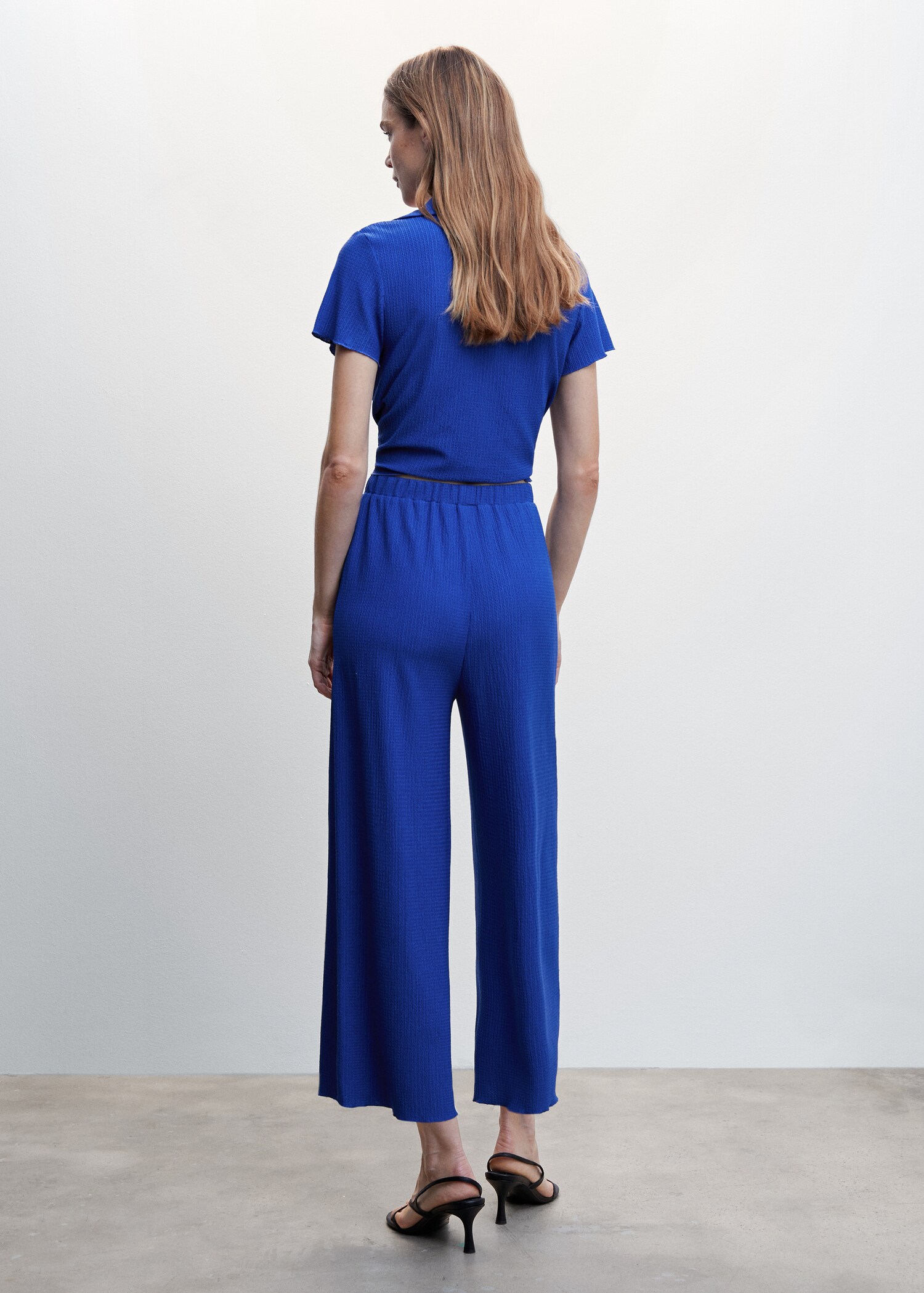 Textured flowy pants - Reverse of the article