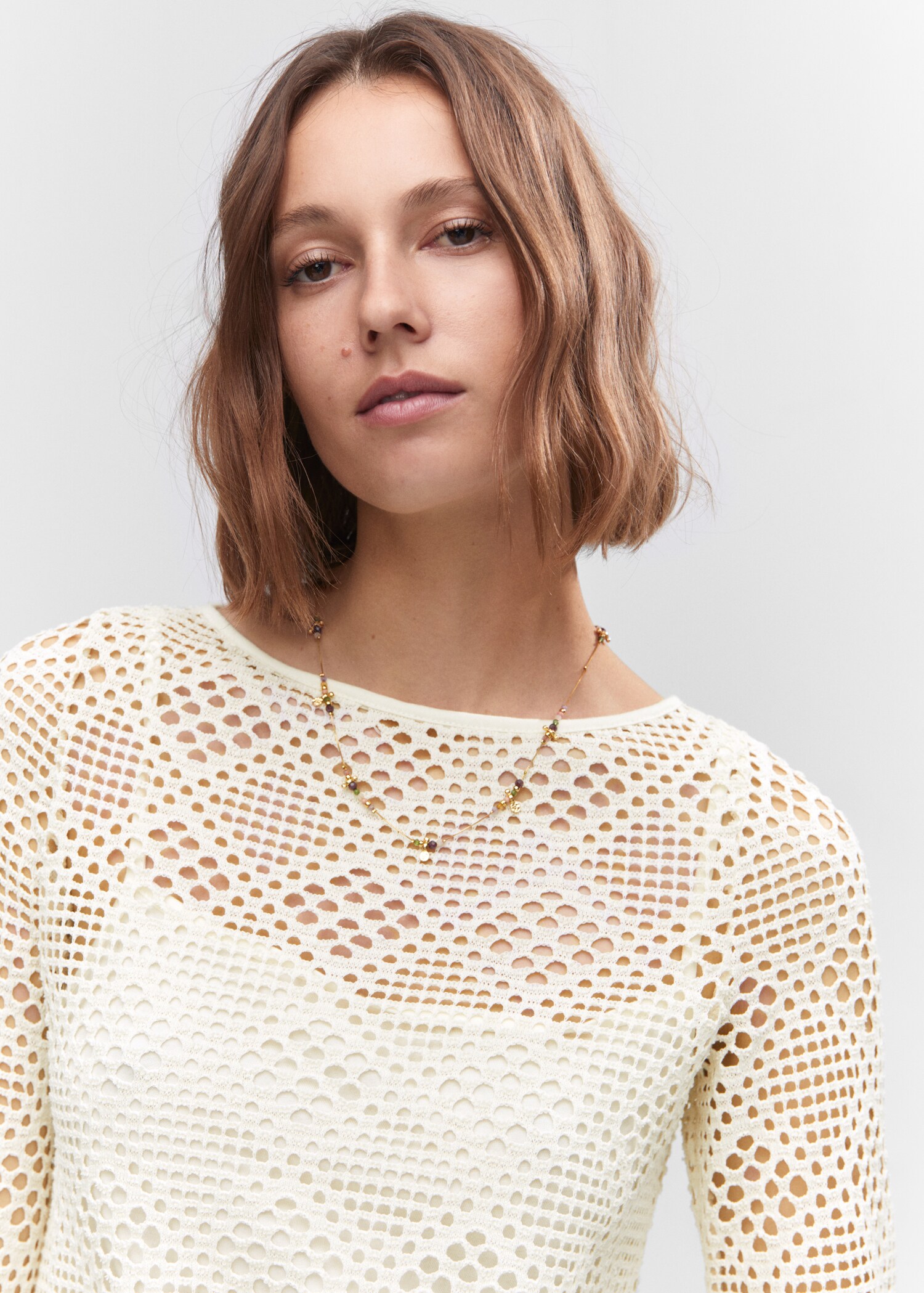 Kleid mit geometrischem Lochmuster - Detail des Artikels 1