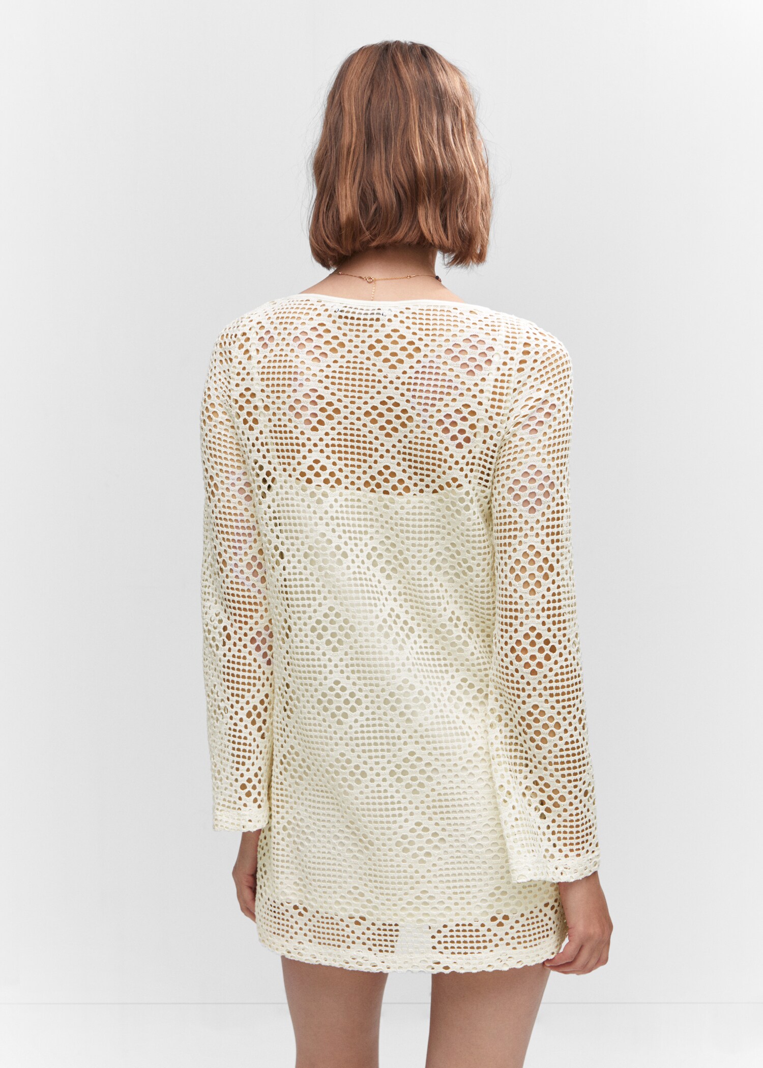 Kleid mit geometrischem Lochmuster - Rückseite des Artikels