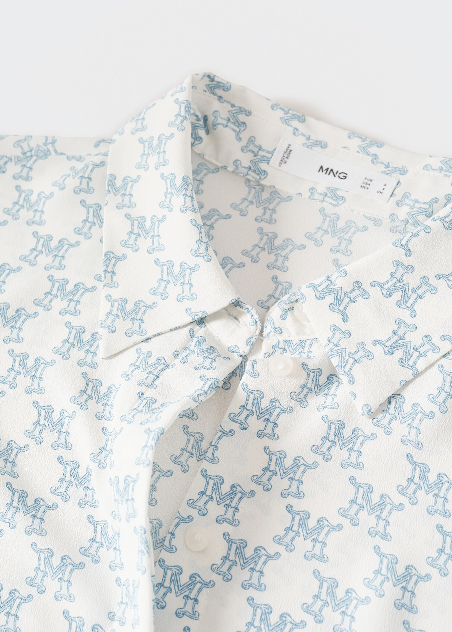 Buttoned flowy shirt - Details of the article 8