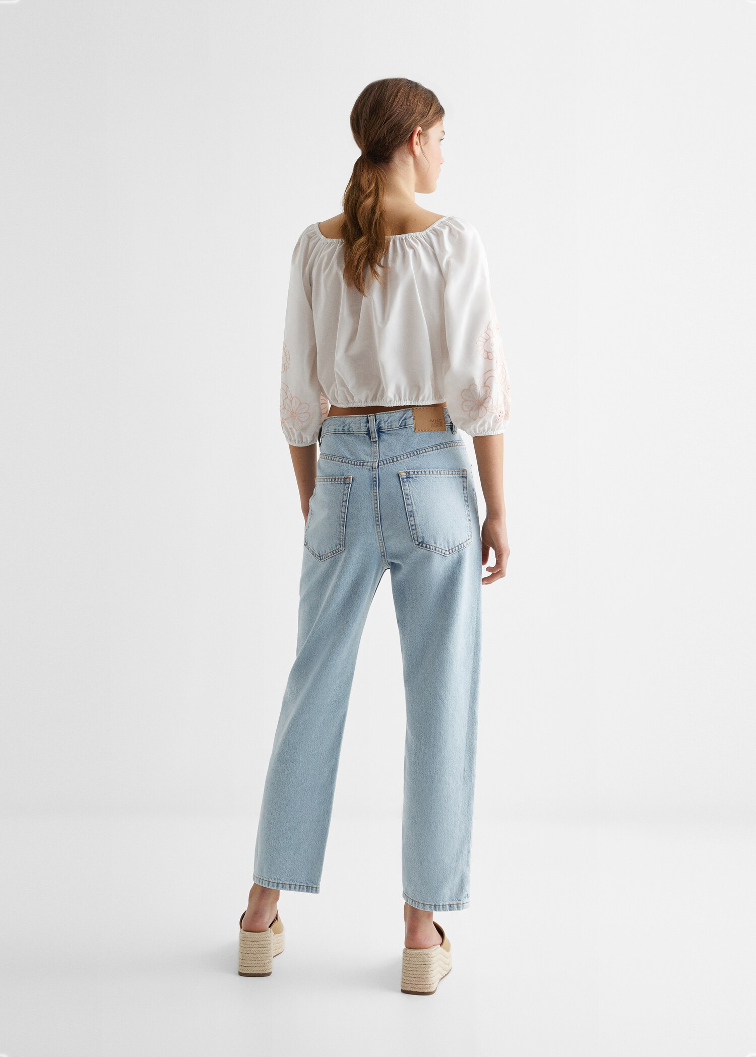 Brusa detalls brodats - Revers de l'article
