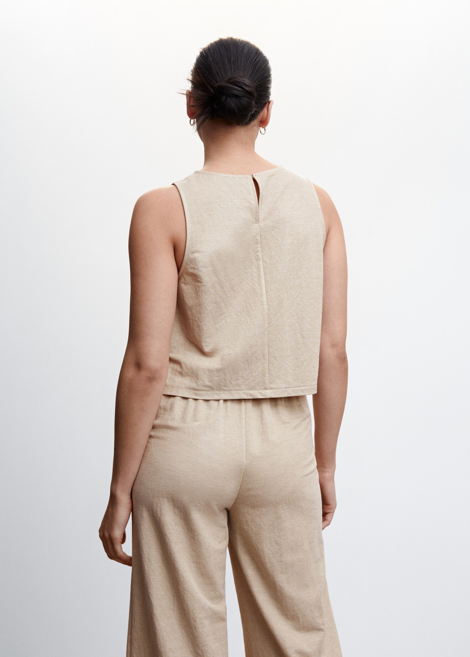 Knitted top with side slits - Reverse of the article