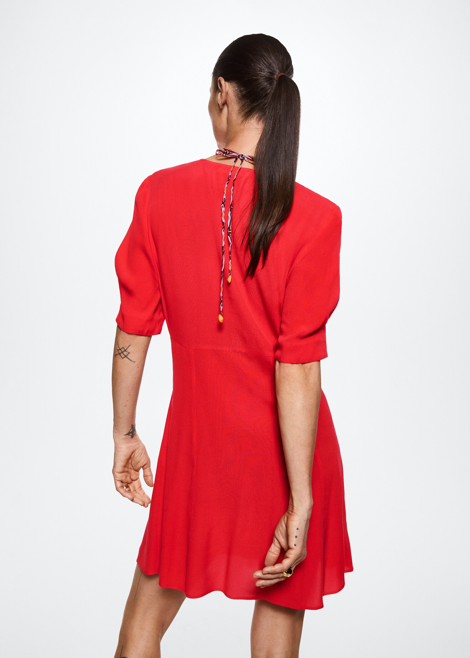 Vestit detall frunzit - Revers de l'article