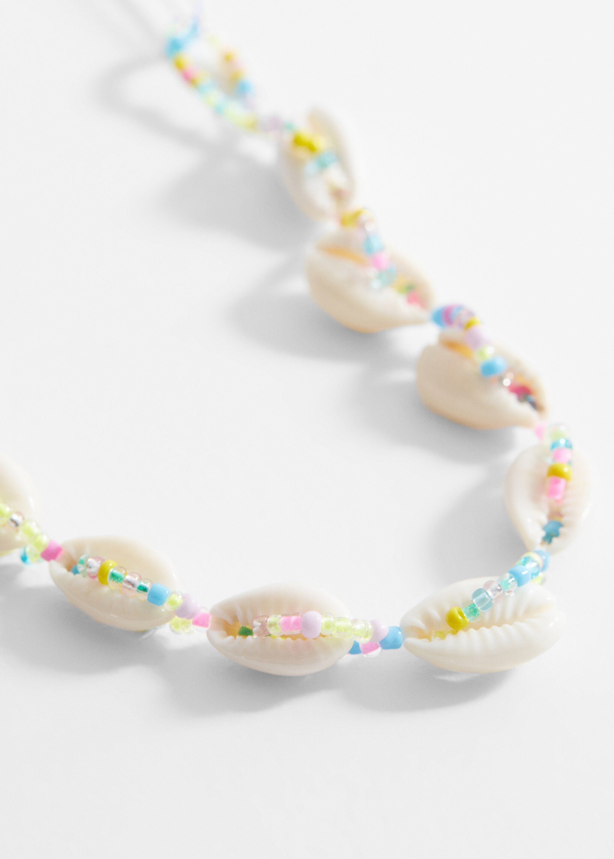 Collier coquillages - Plan moyen