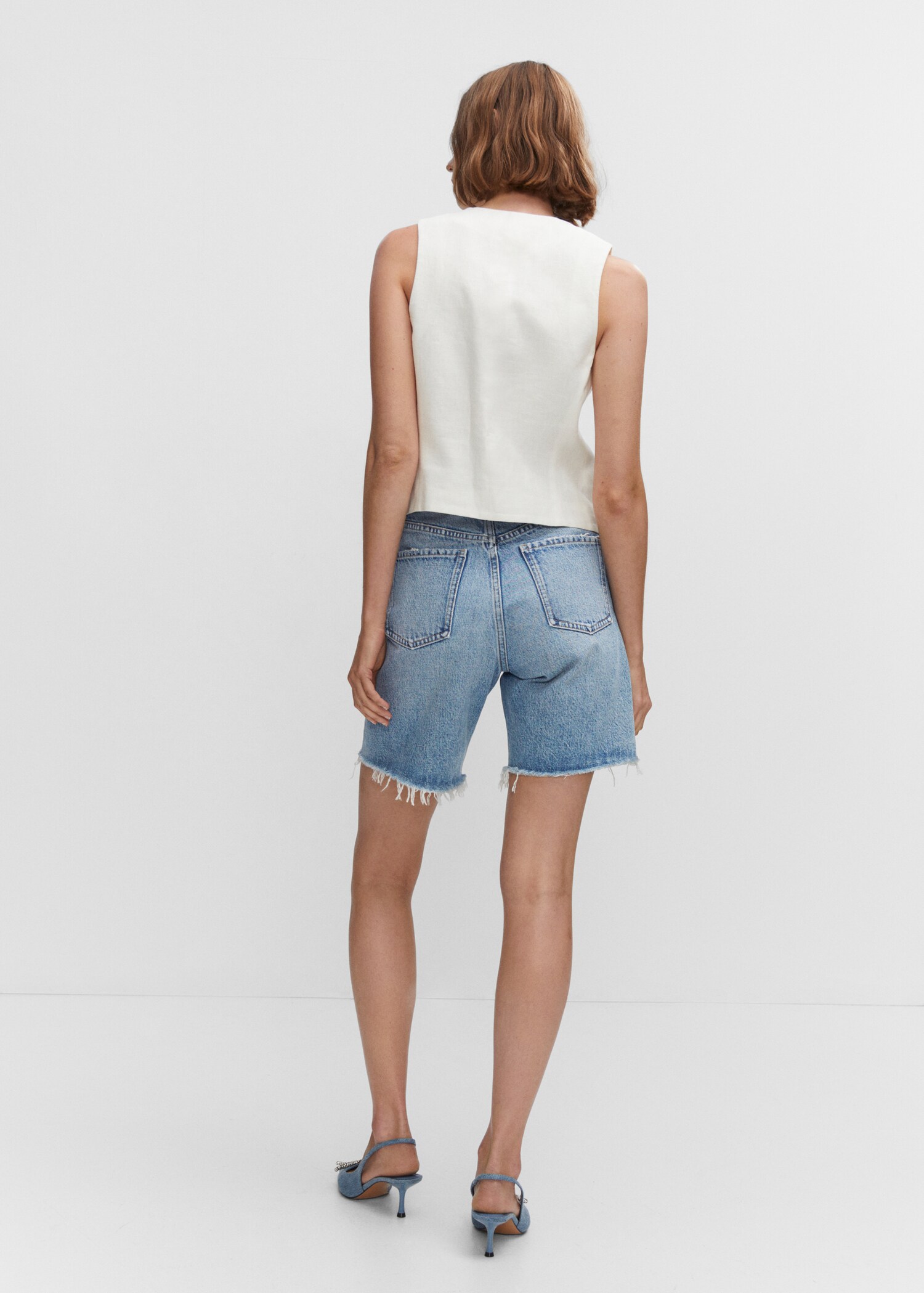 Decorative ripped denim bermuda shorts - Reverse of the article