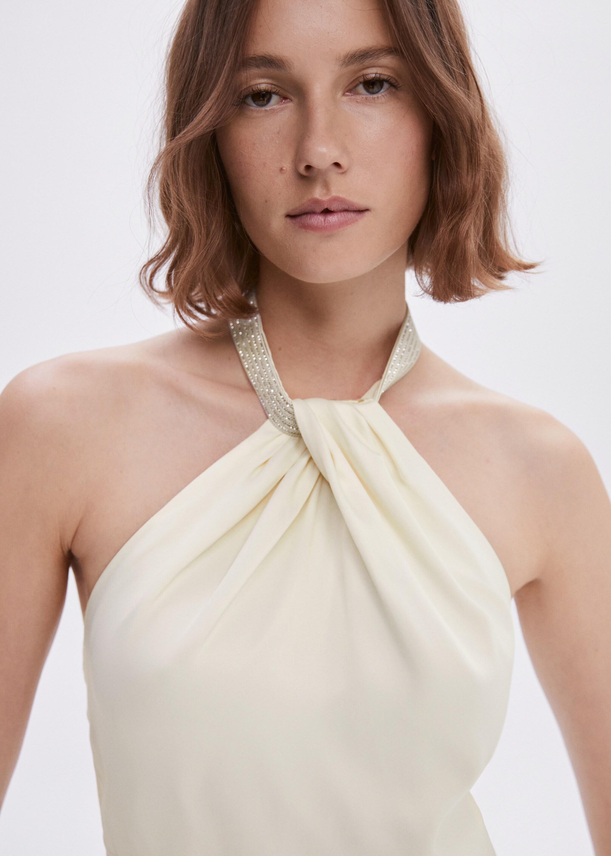 Halter-neck jumpsuit with metallic detail - Details of the article 1, Ecru. Ref: 57001089-00.