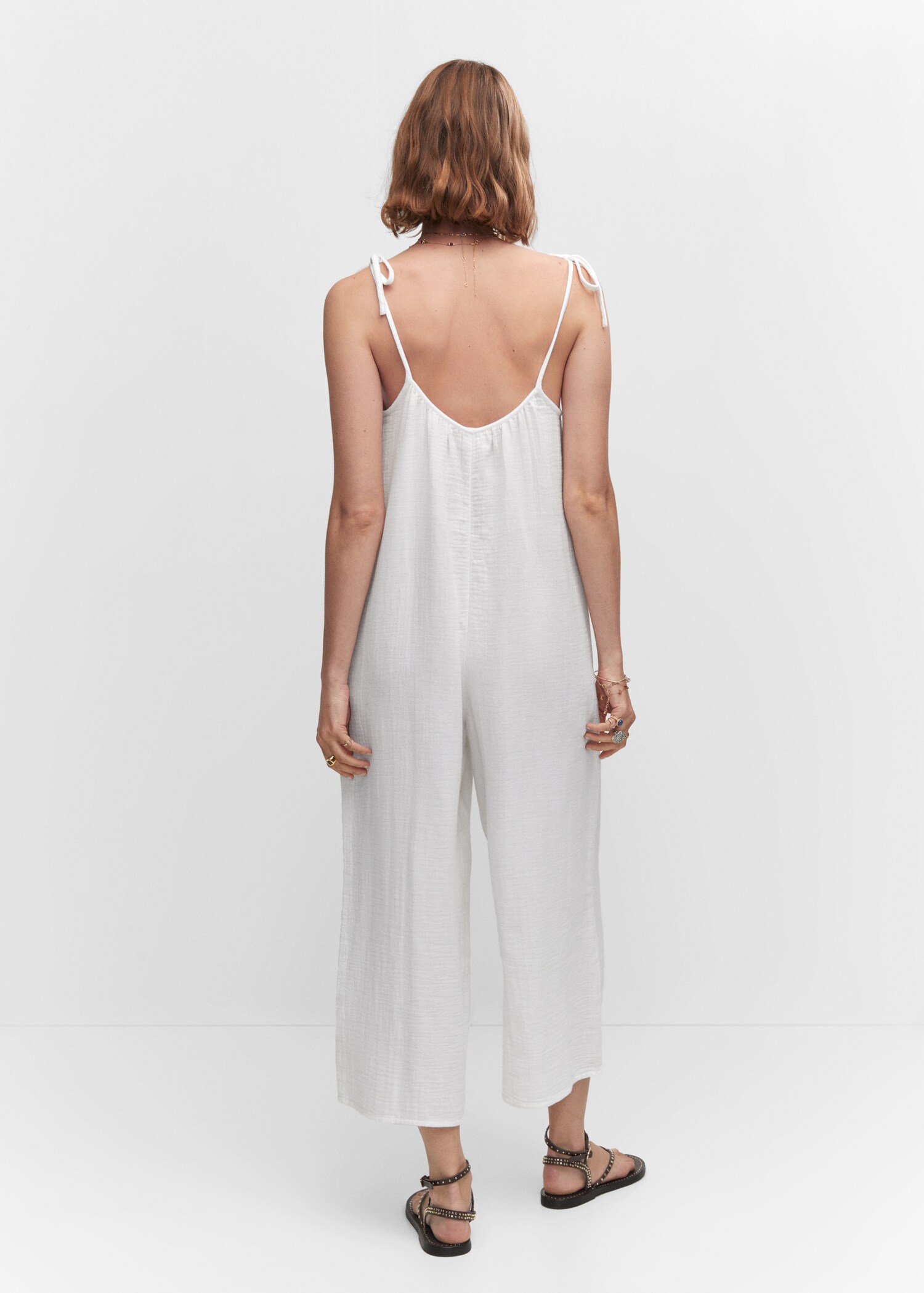 Textured jumpsuit with bows - Reverse of the article