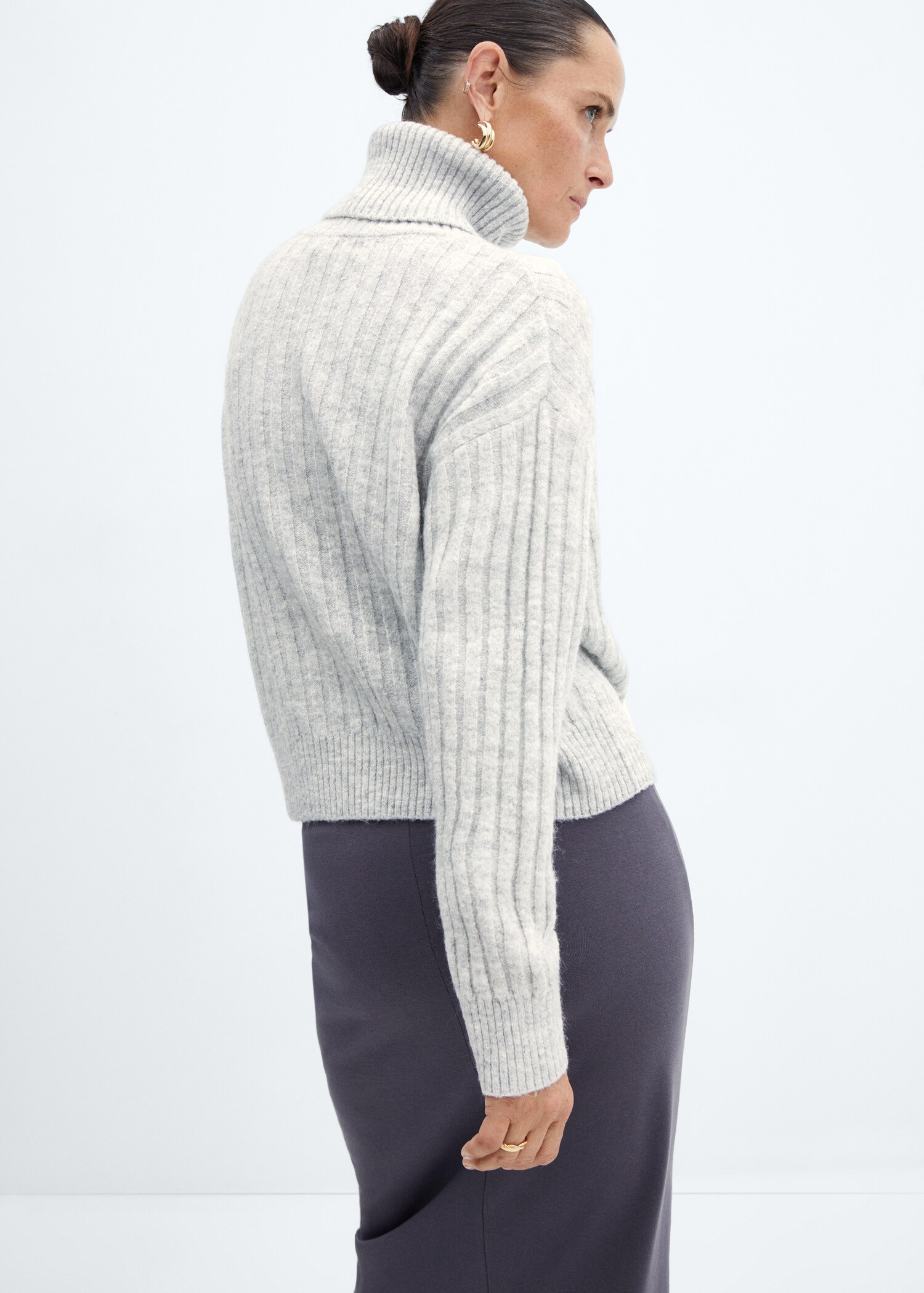 Rolled neck cable sweater - Reverse of the article