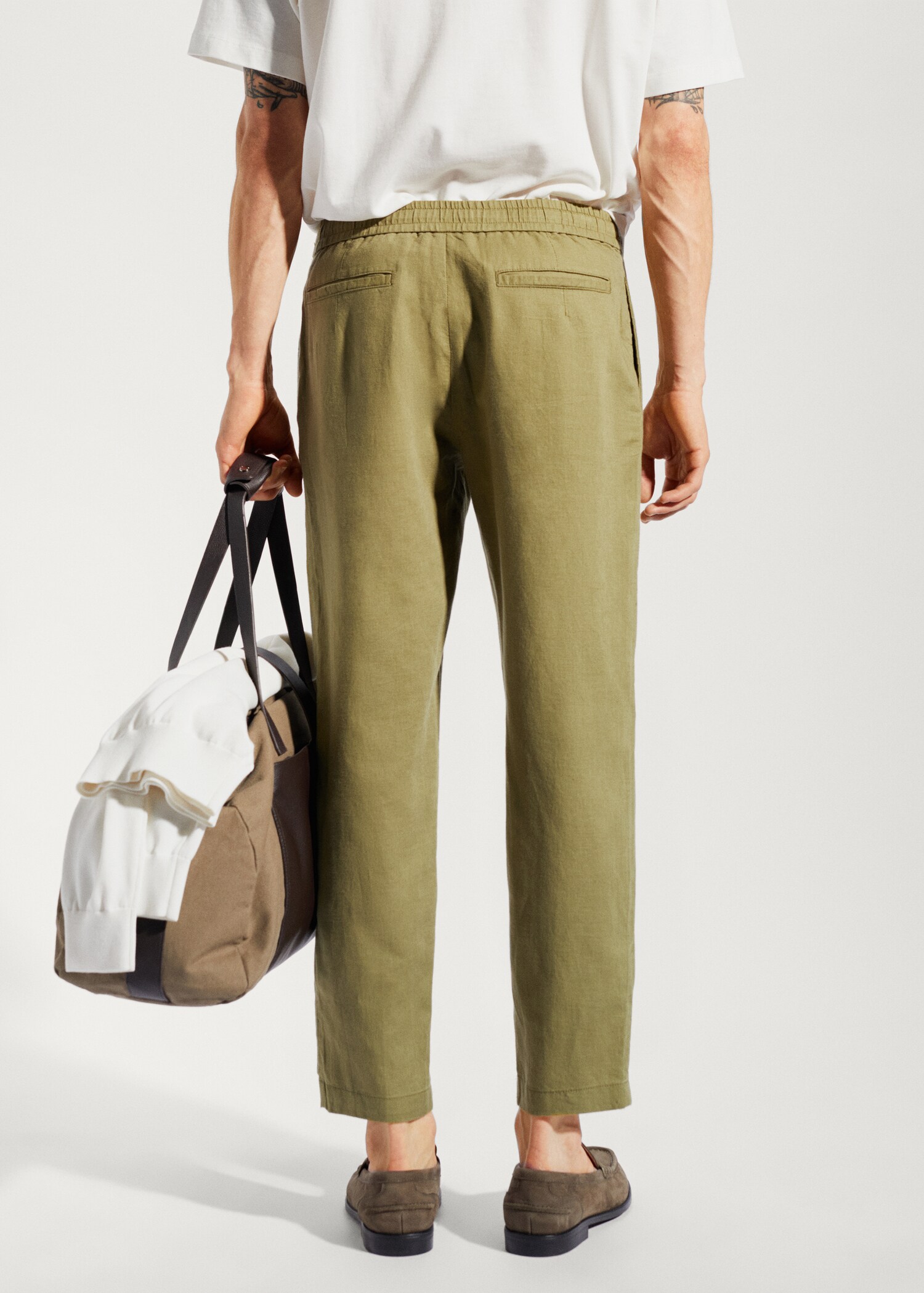 Slim-fit trousers with drawstring - Reverse of the article