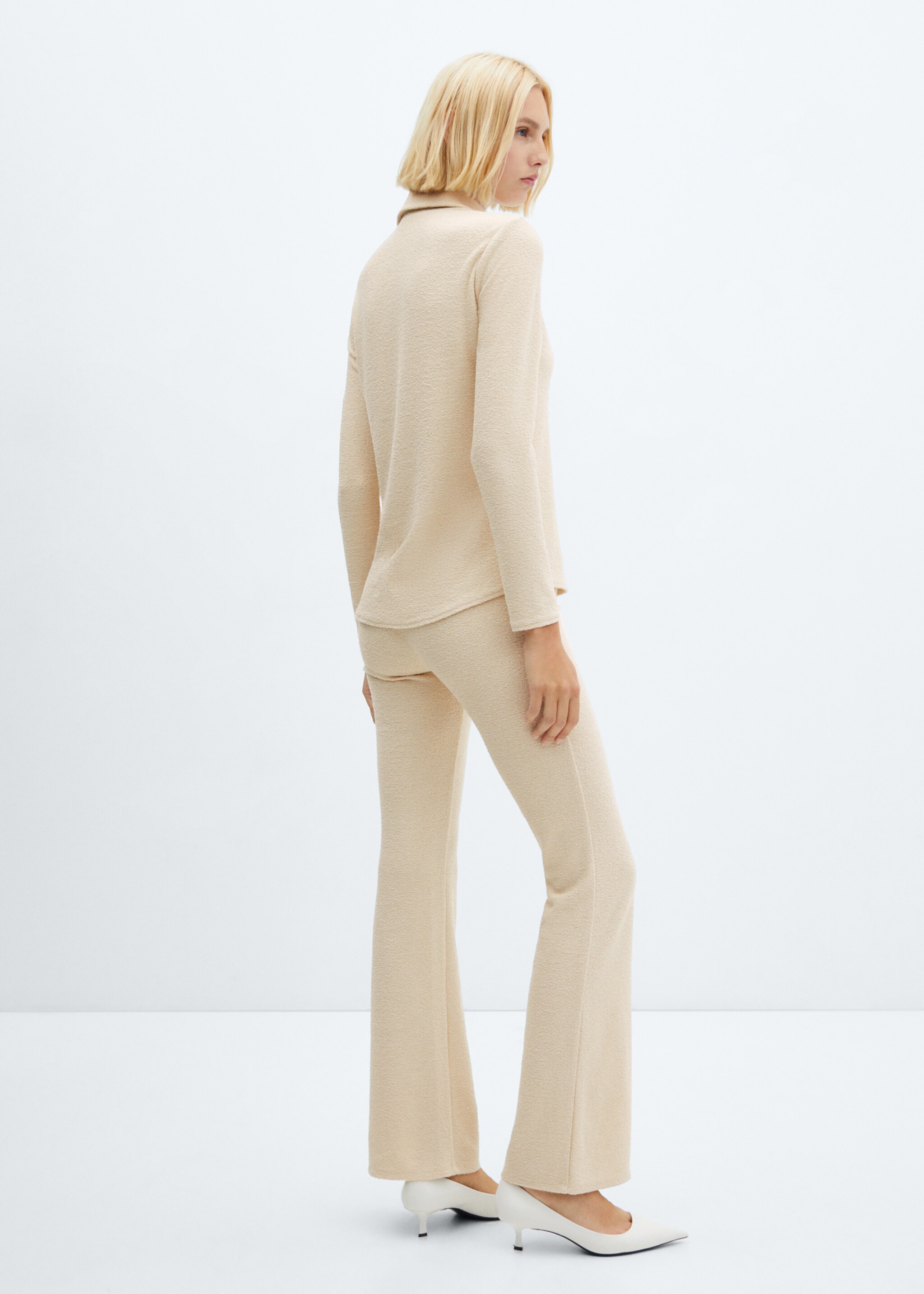 Flared knitted trousers - Reverse of the article, Off White. Ref: 57049123-00.