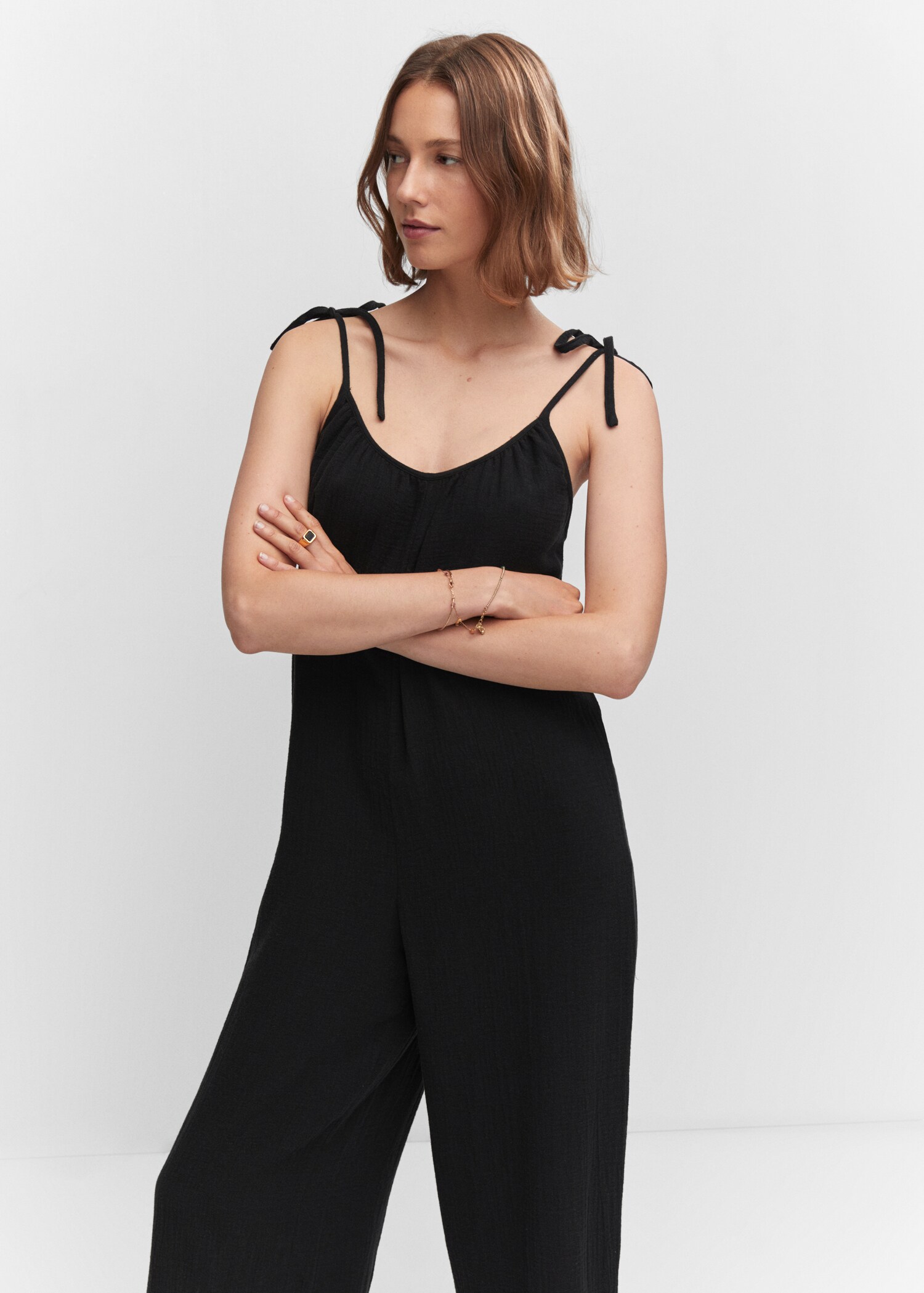 Textured jumpsuit with bows - Medium plane