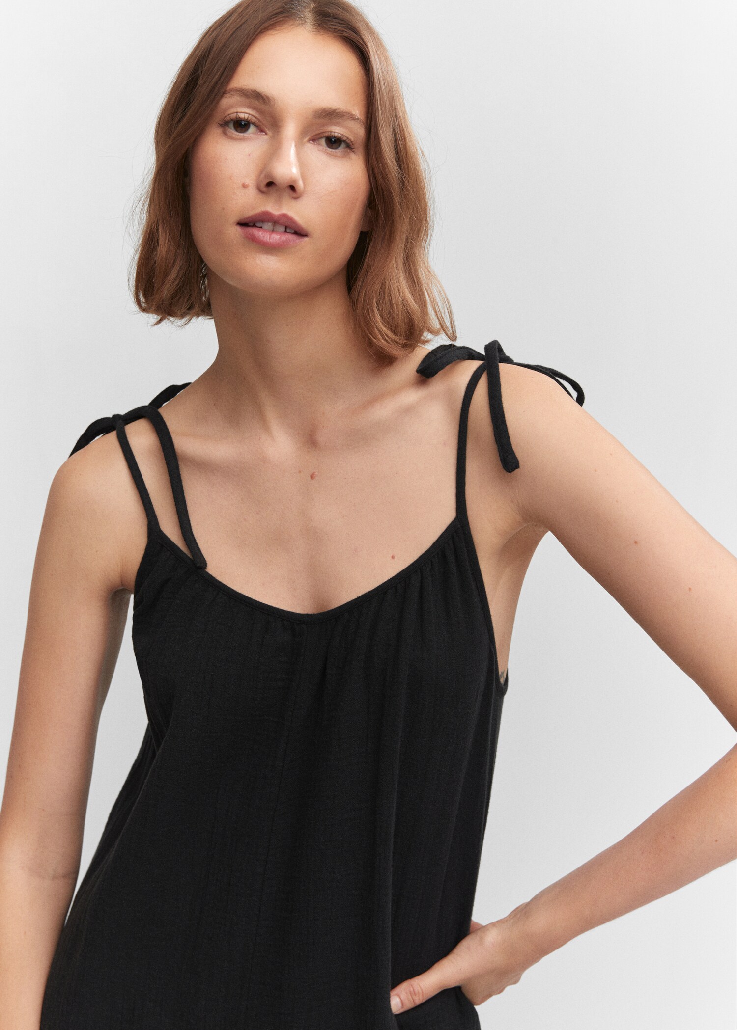 Textured jumpsuit with bows - Details of the article 1