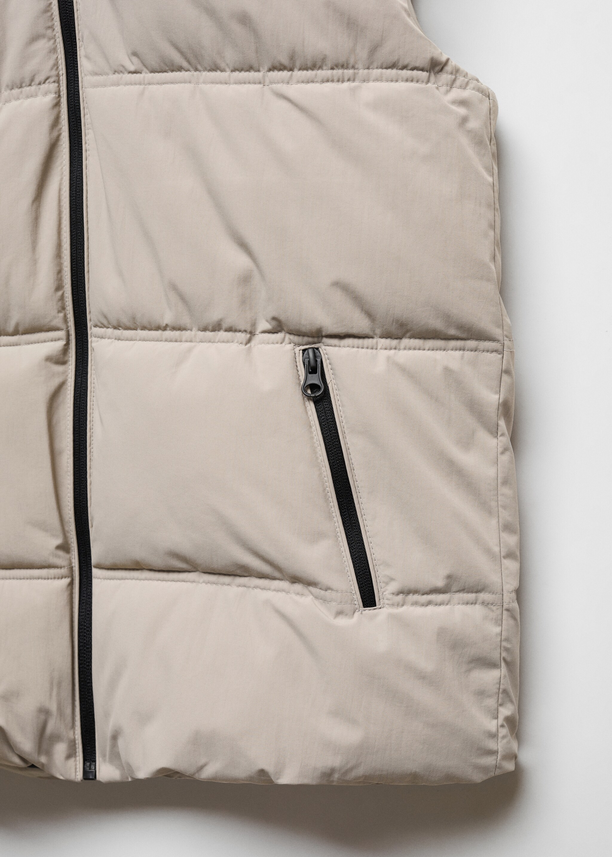 Bodywarmer - Detail van het artikel 8