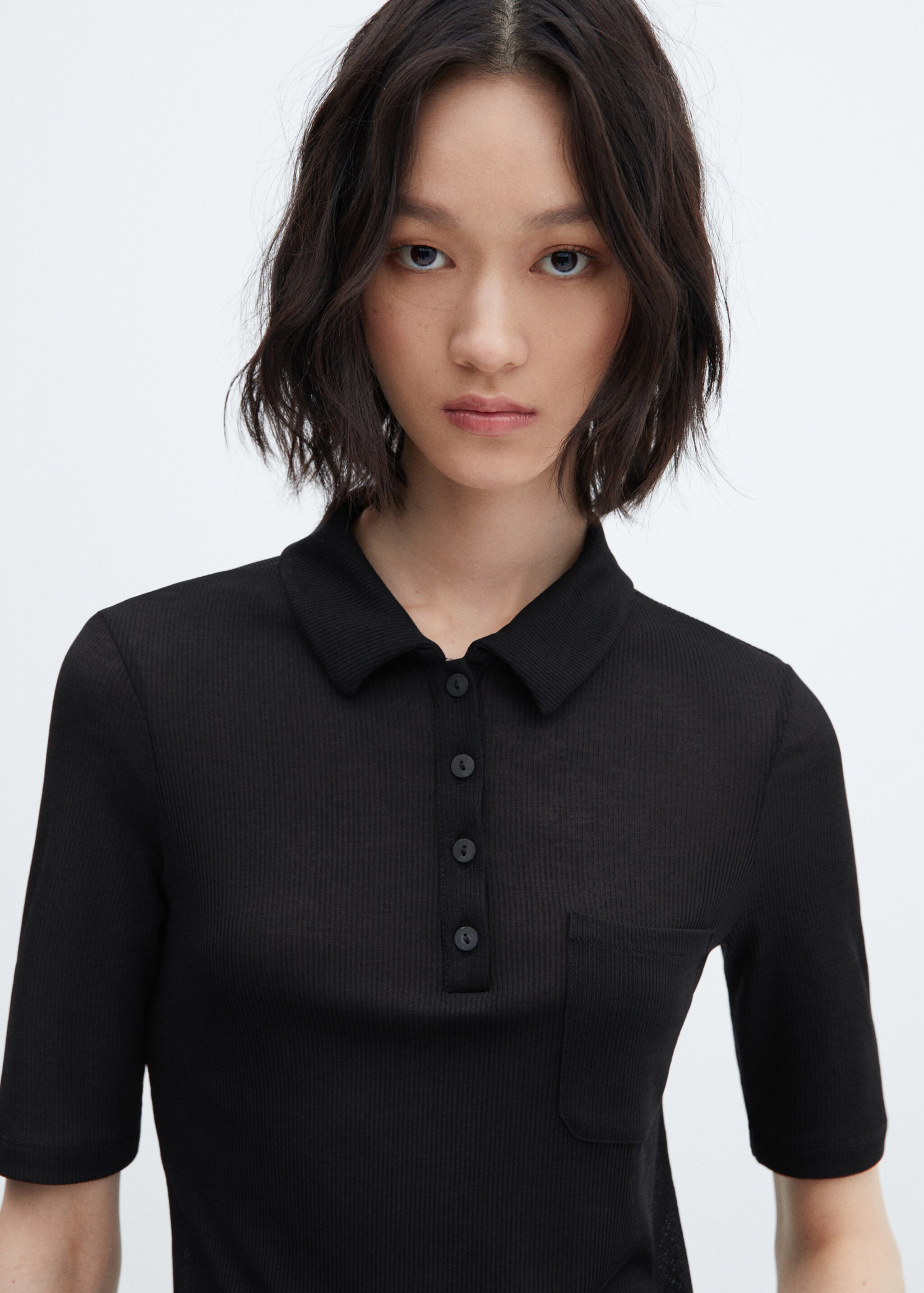 Short-sleeved polo shirt with buttons - Details of the article 1, Black. Ref: 57074029-00.