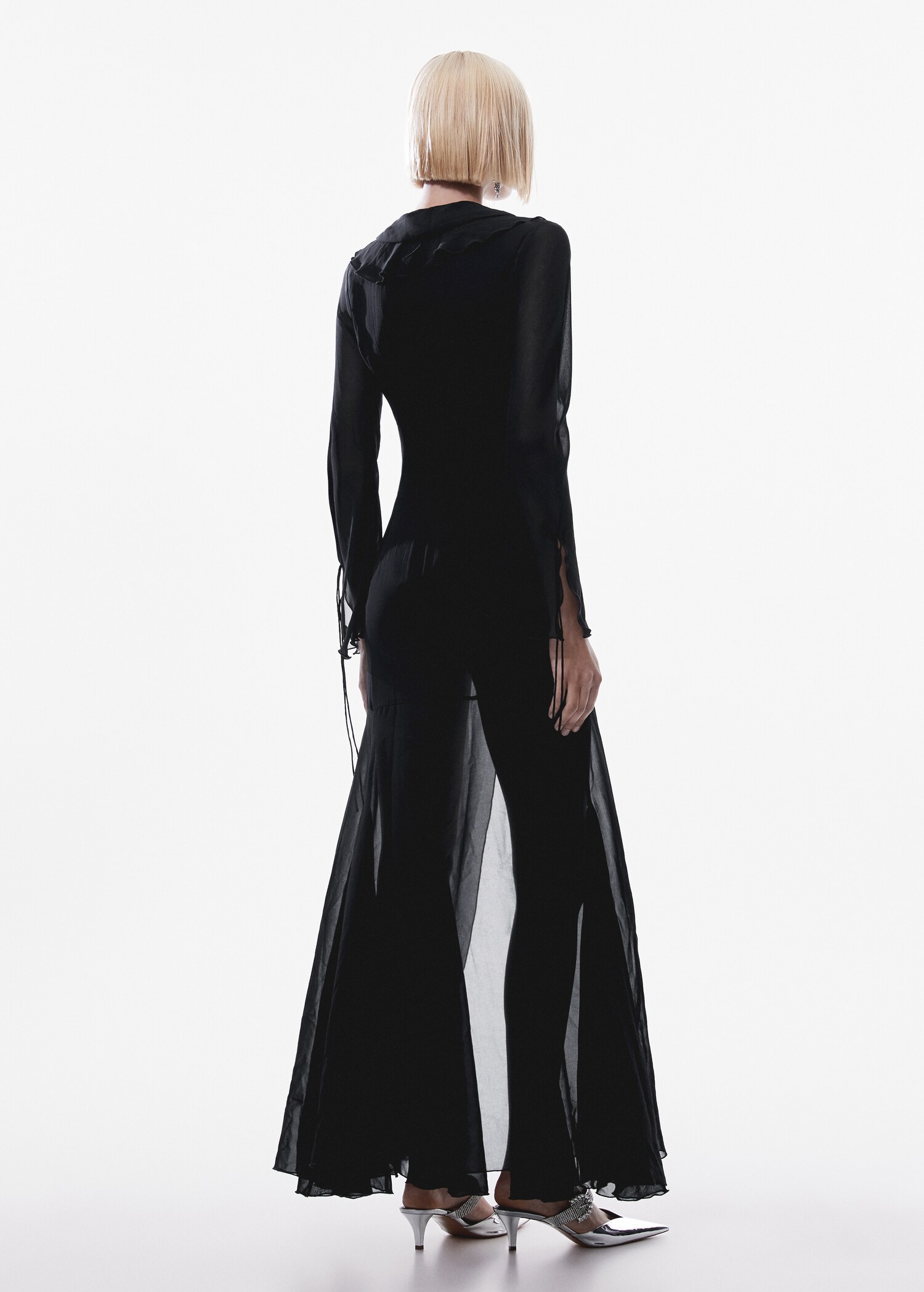 Flared dress with ruffled sleeves - Reverse of the article