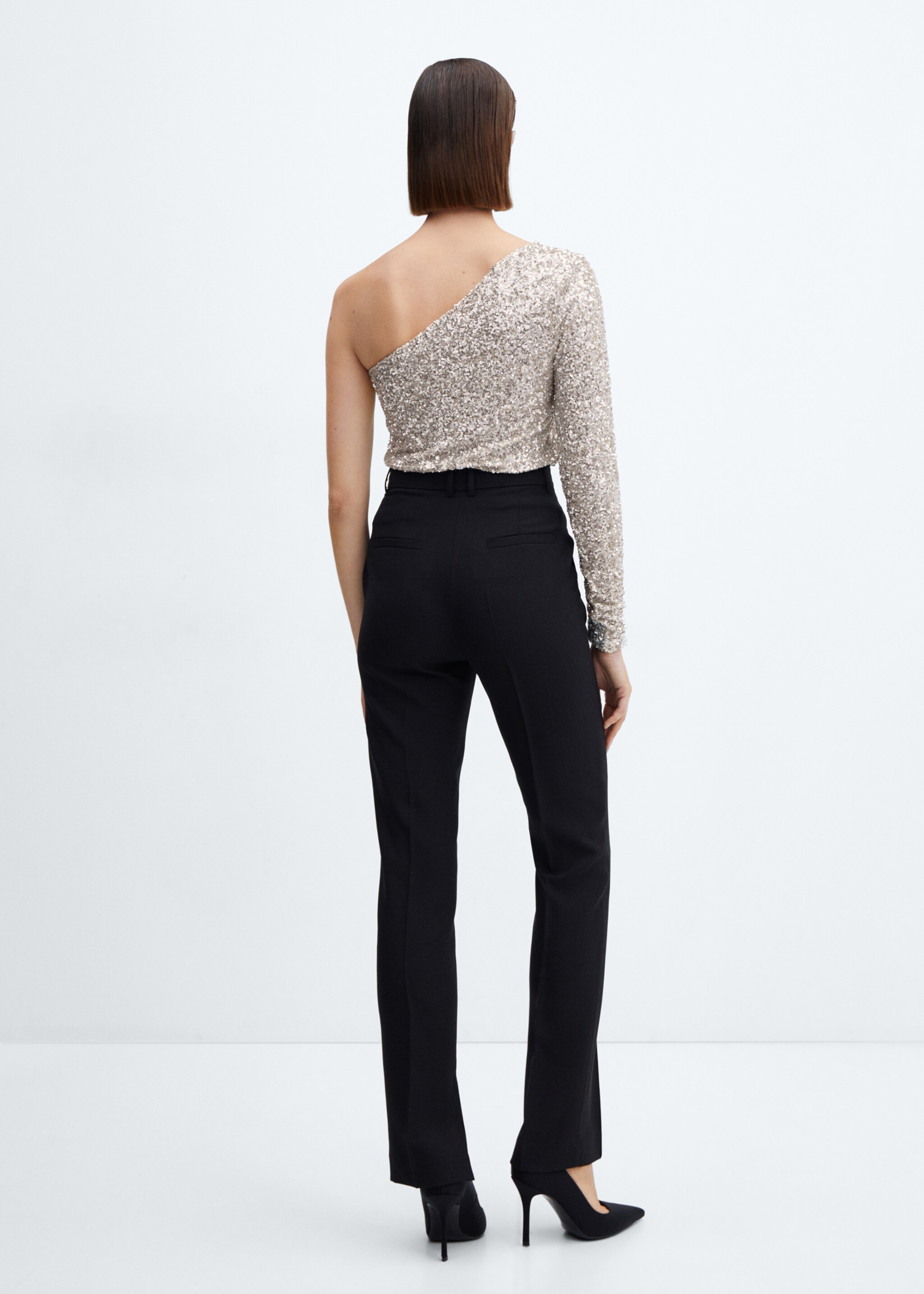 Top asymétrique sequins - Verso de l’article