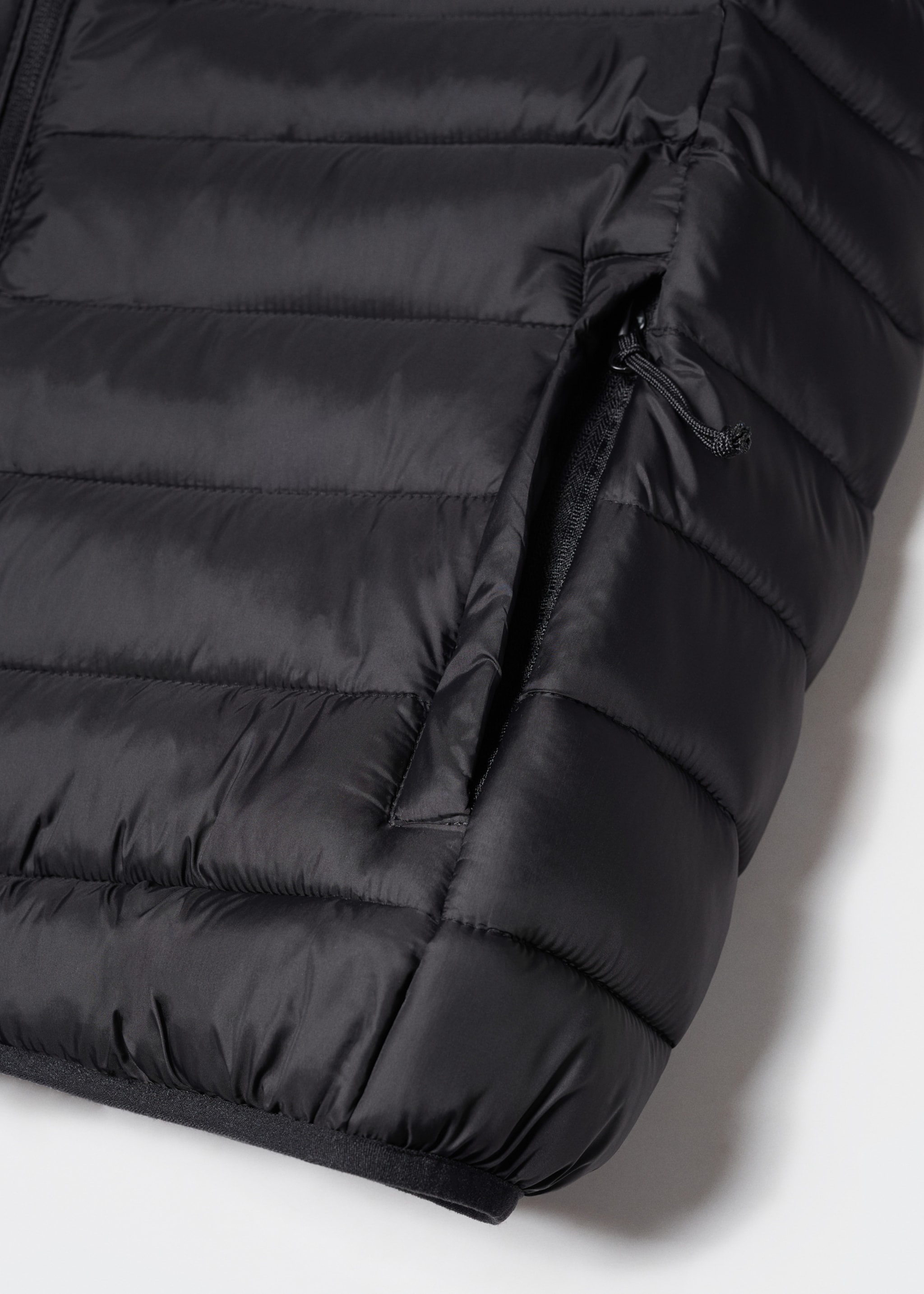 Bodywarmer - Detail van het artikel 8