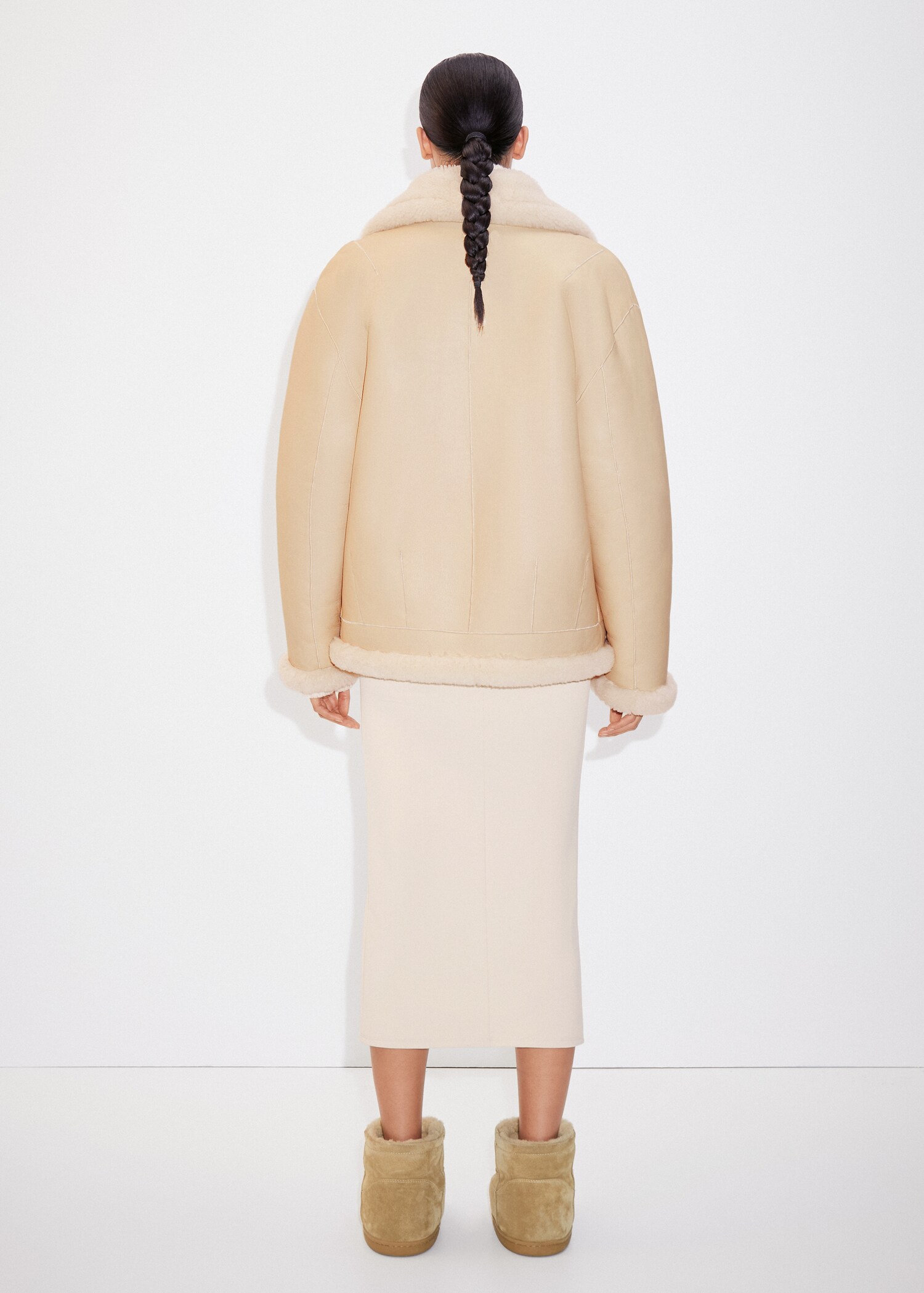 Reversible leather and fur-effect coat - Reverse of the article