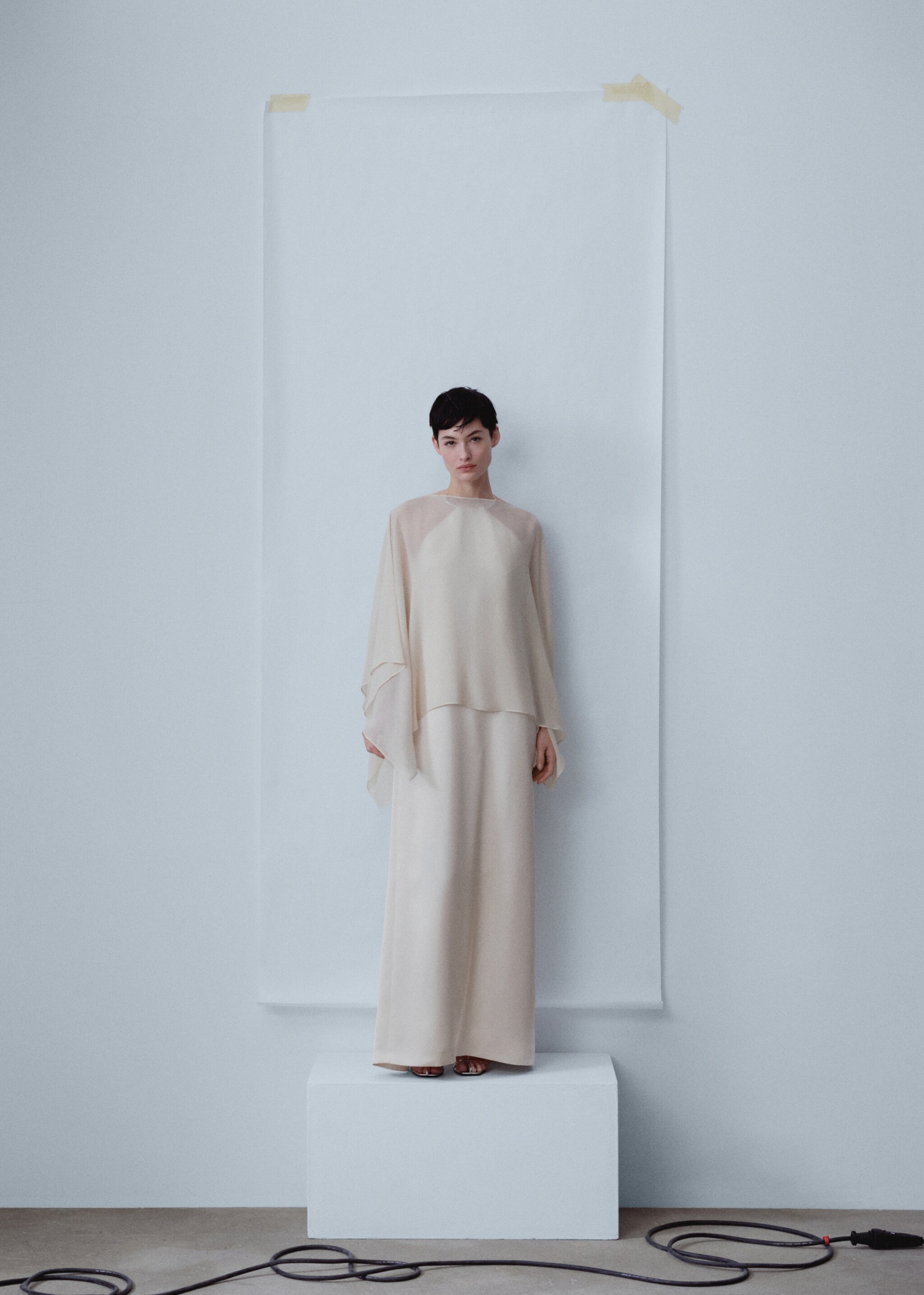 Asymmetric semi-transparent cape - General plane, Beige. Ref: 57053276-00.