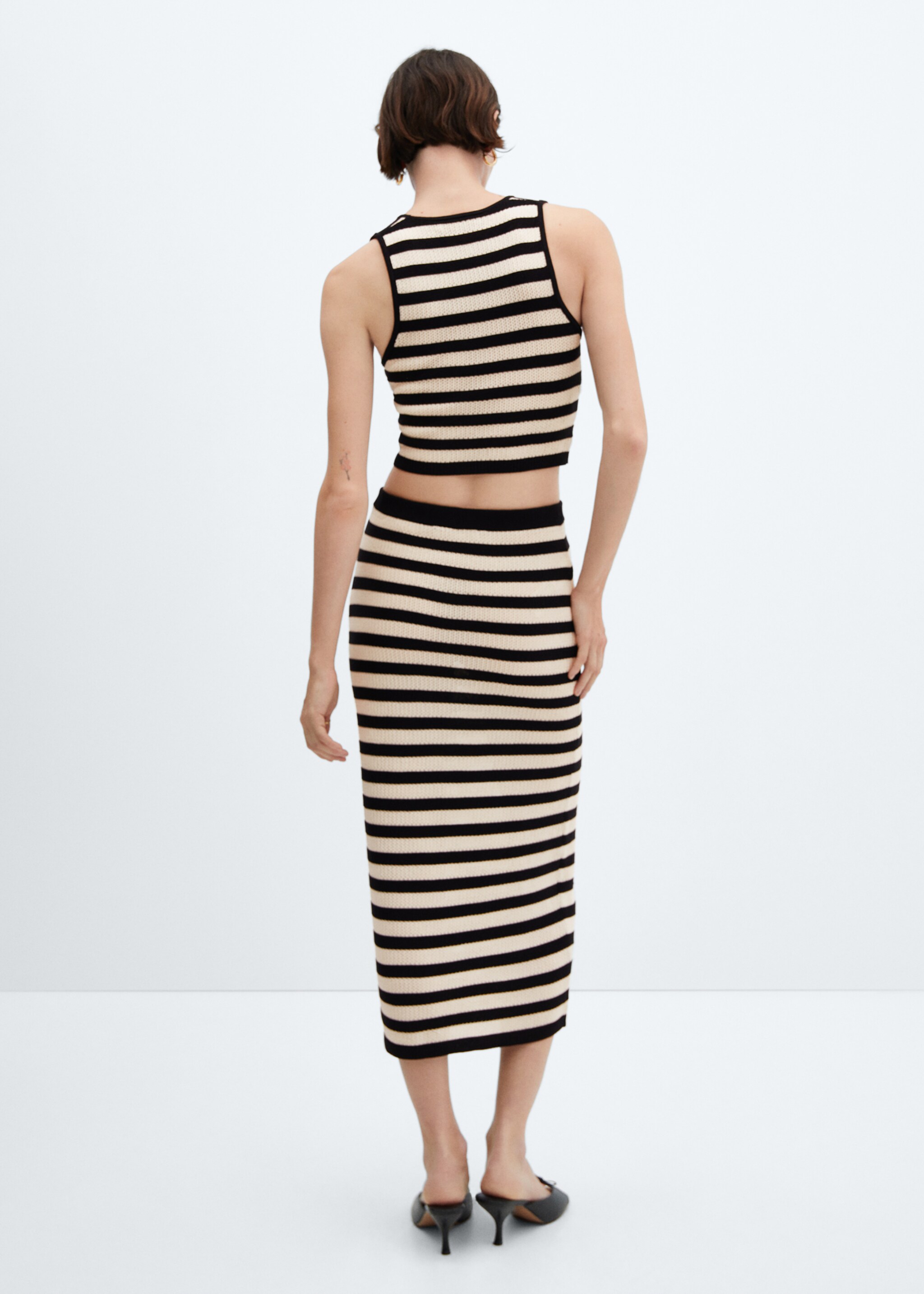 Knitted skirt with openwork details - Reverse of the article