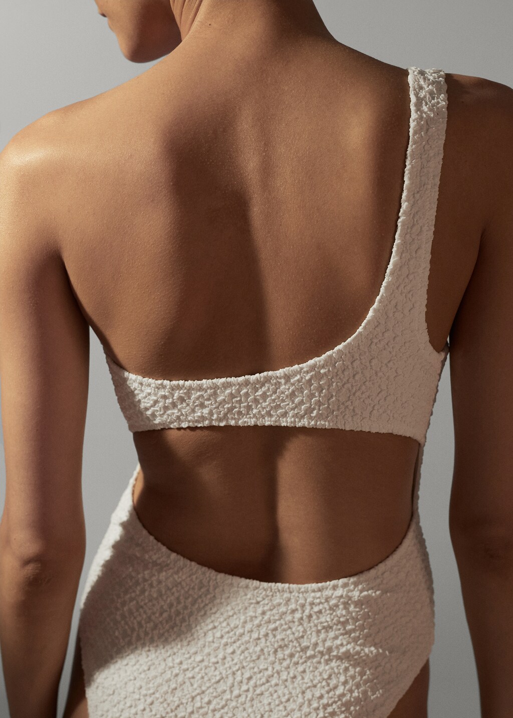 Asymmetrical textured swimsuit - Women | MANGO OUTLET USA