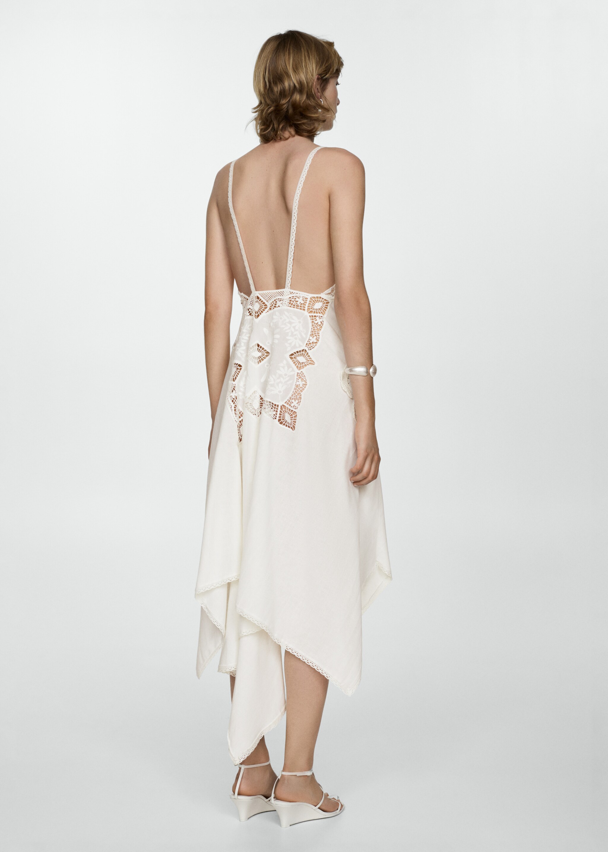 Asymmetrical dress with embroidered panels - Reverse of the article