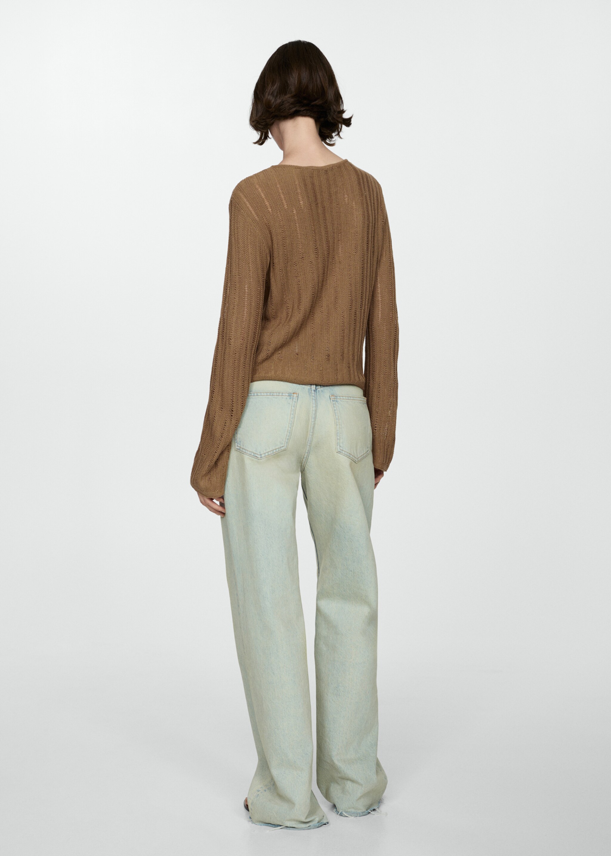 Flared-sleeve unstitched sweater - Reverse of the article