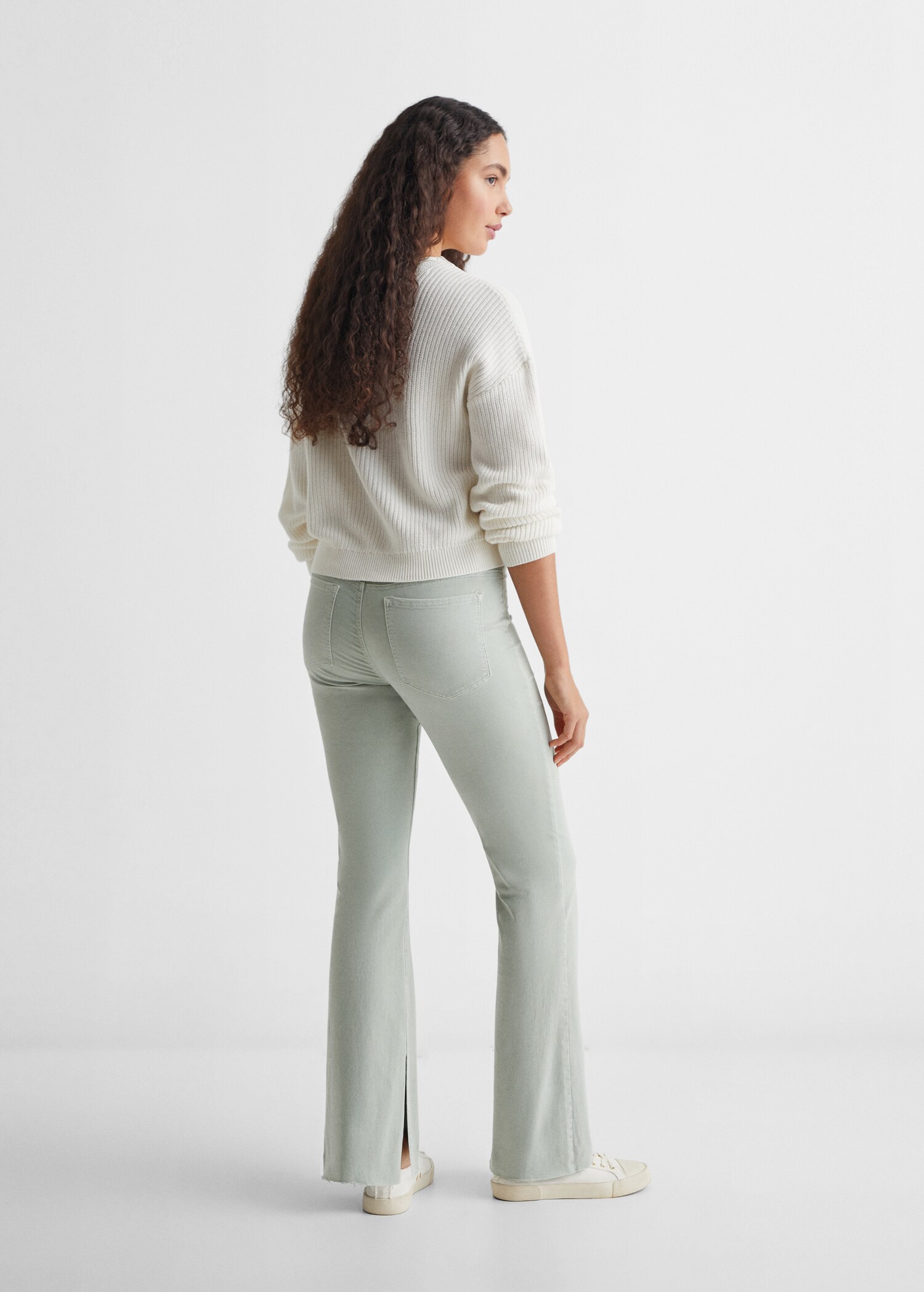 Flared jeans with opening - Reverse of the article
