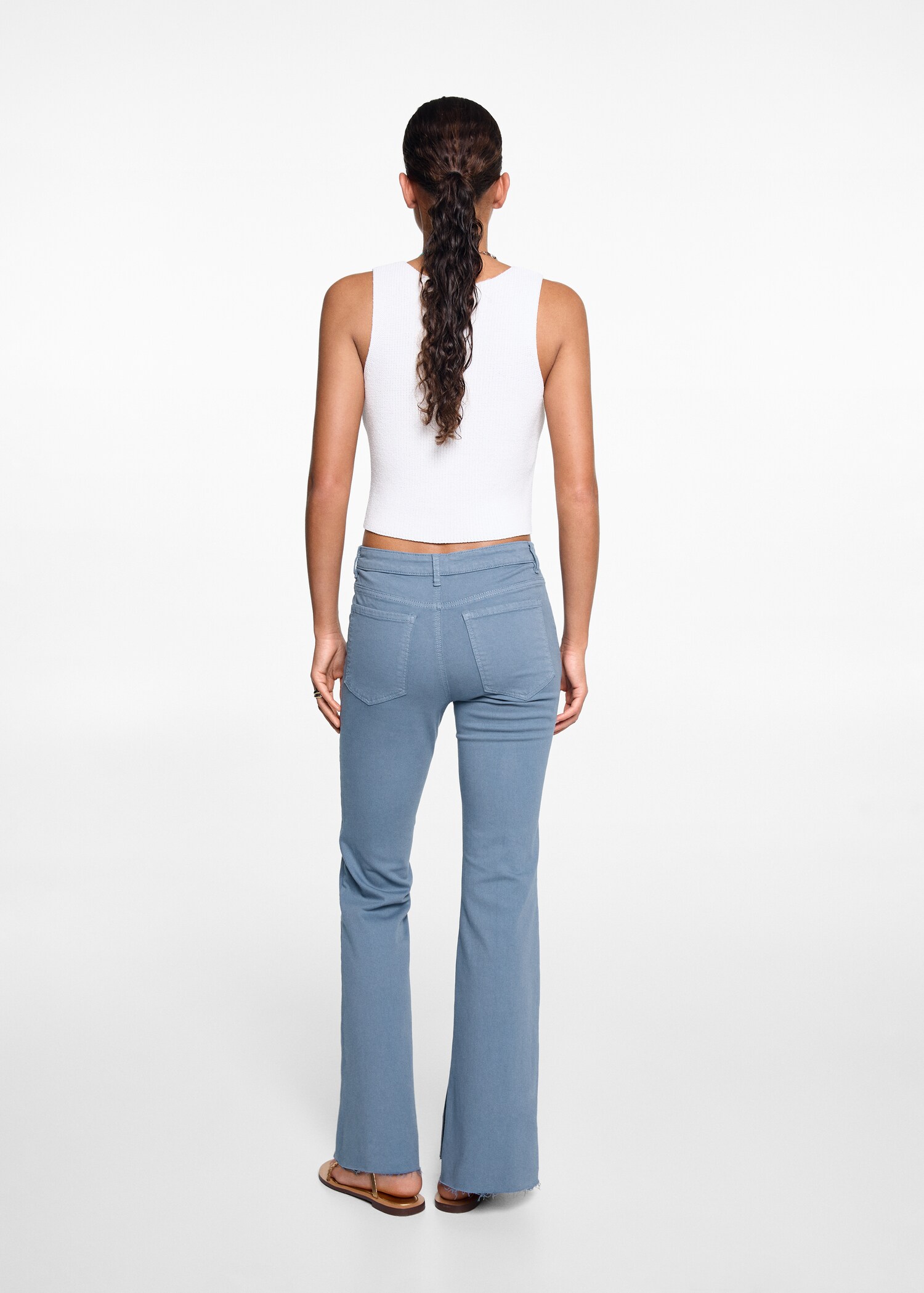Flared jeans with opening - Reverse of the article