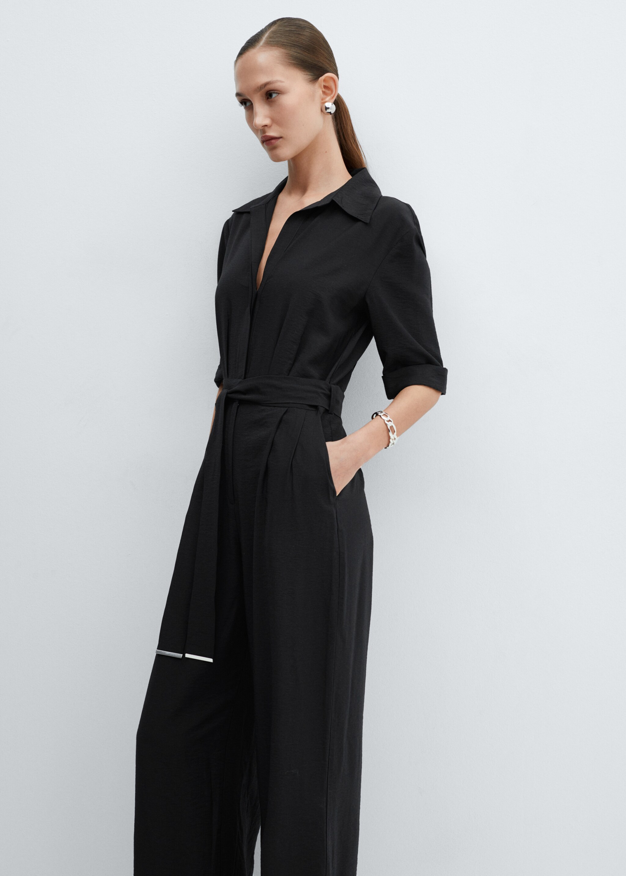 Belt long jumpsuit - Details of the article 1, Black. Ref: 67055750-00.