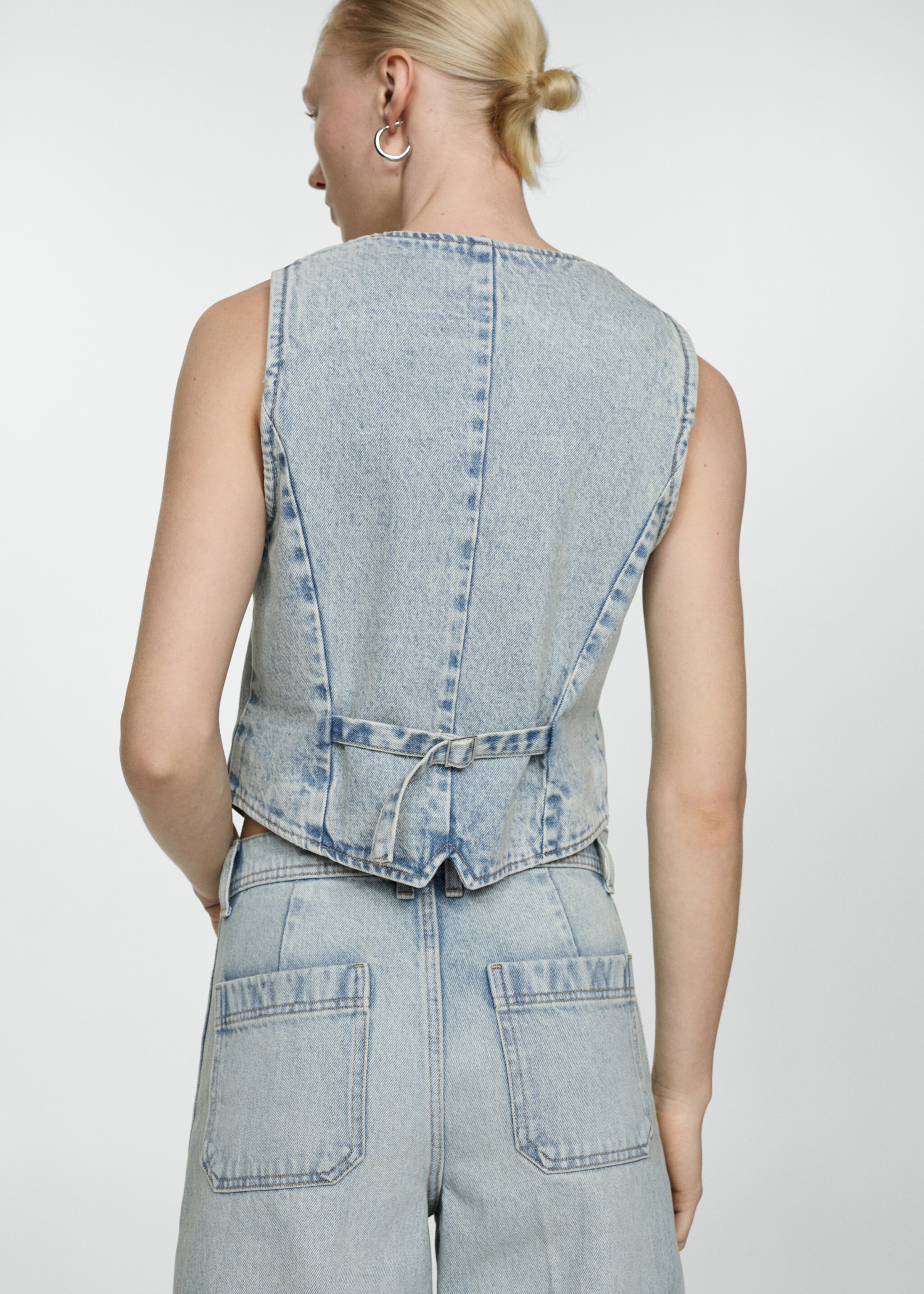 Denim gilet with seams - Reverse of the article