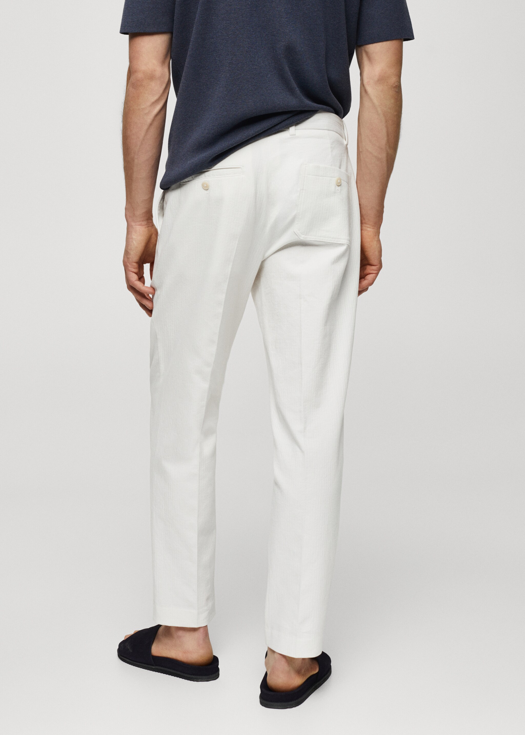 Slim-fit trousers with pleated texture - Reverse of the article