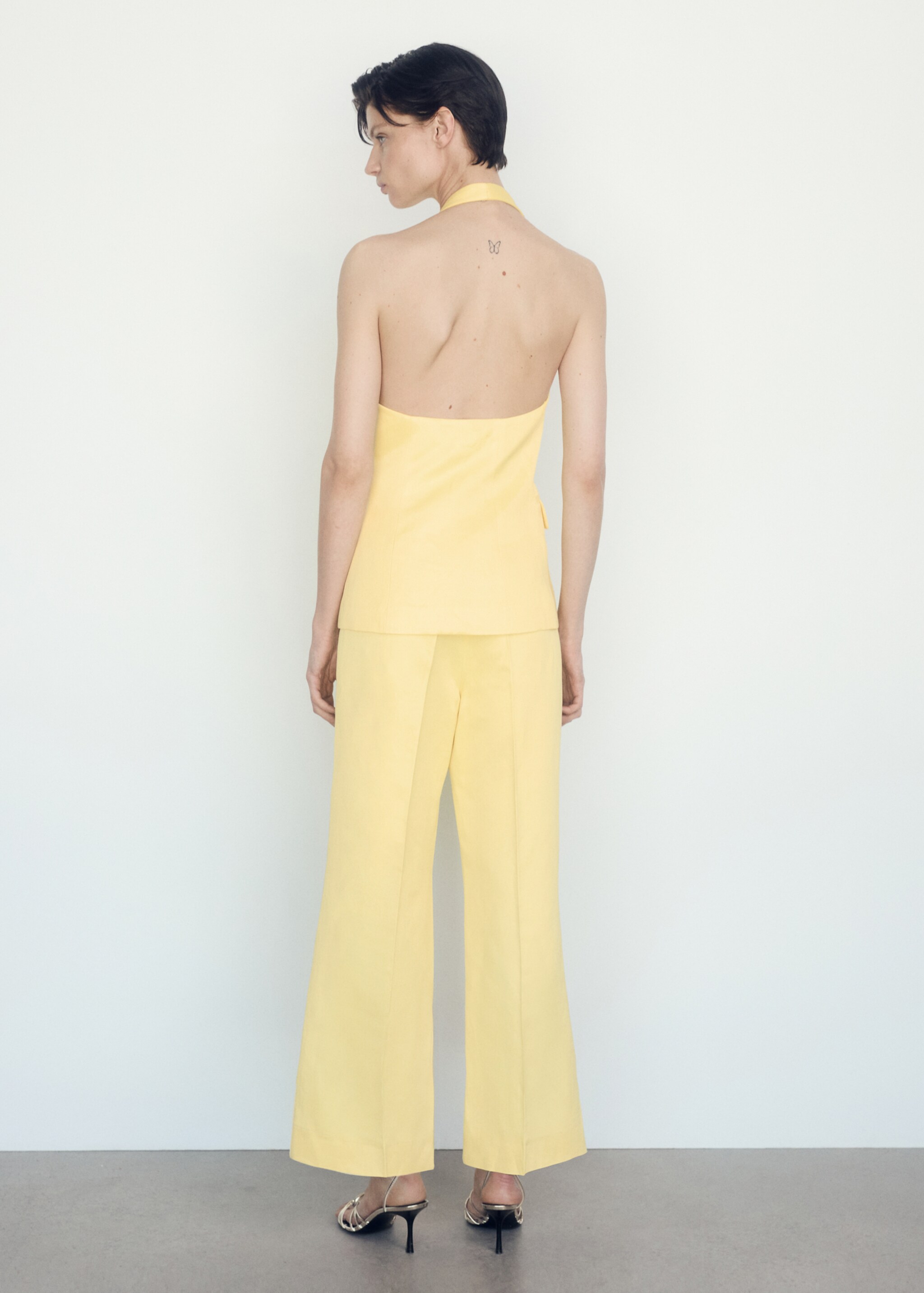 Flared trousers with pleated detail - Reverse of the article