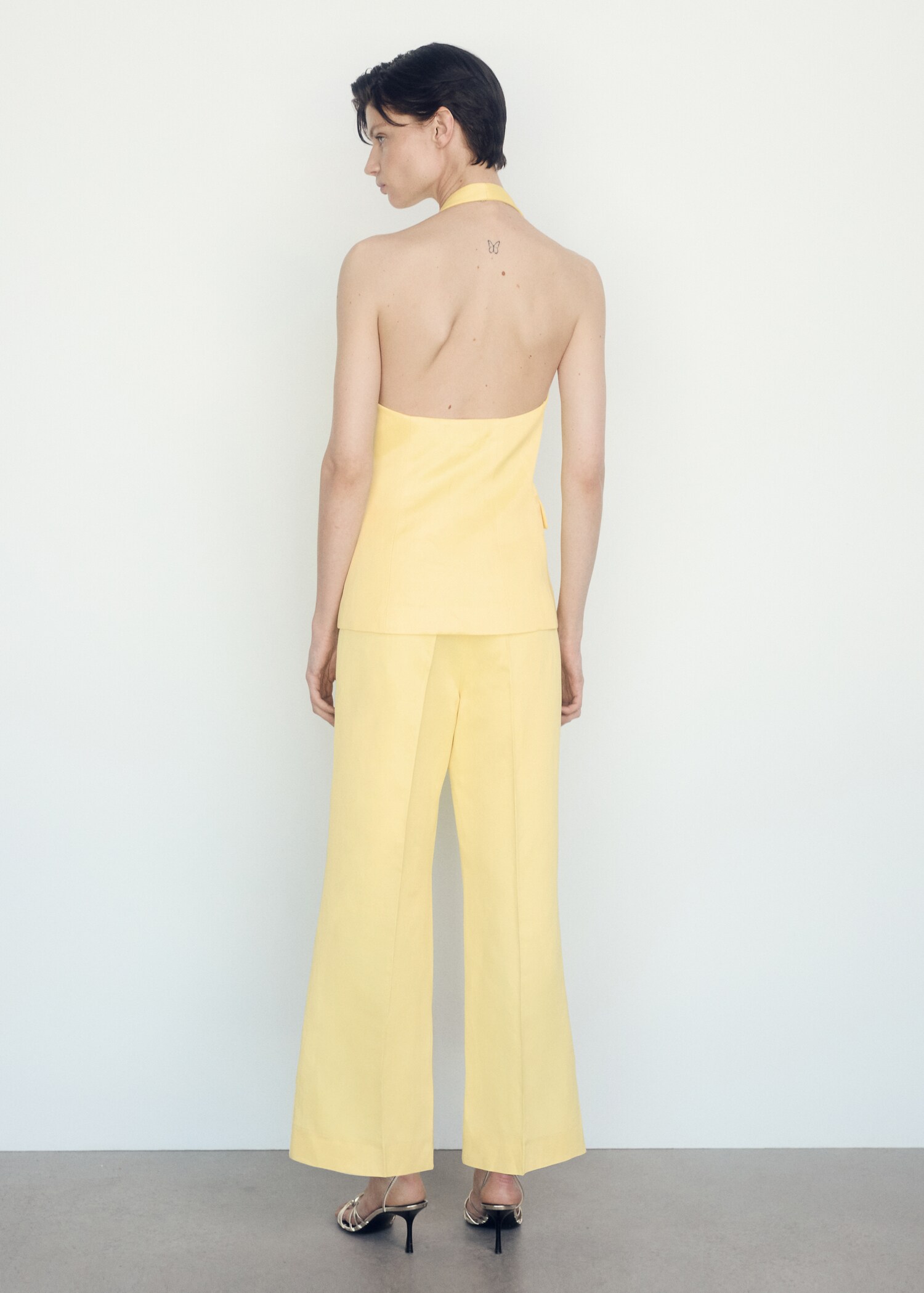 Flared trousers with pleated detail - Reverse of the article